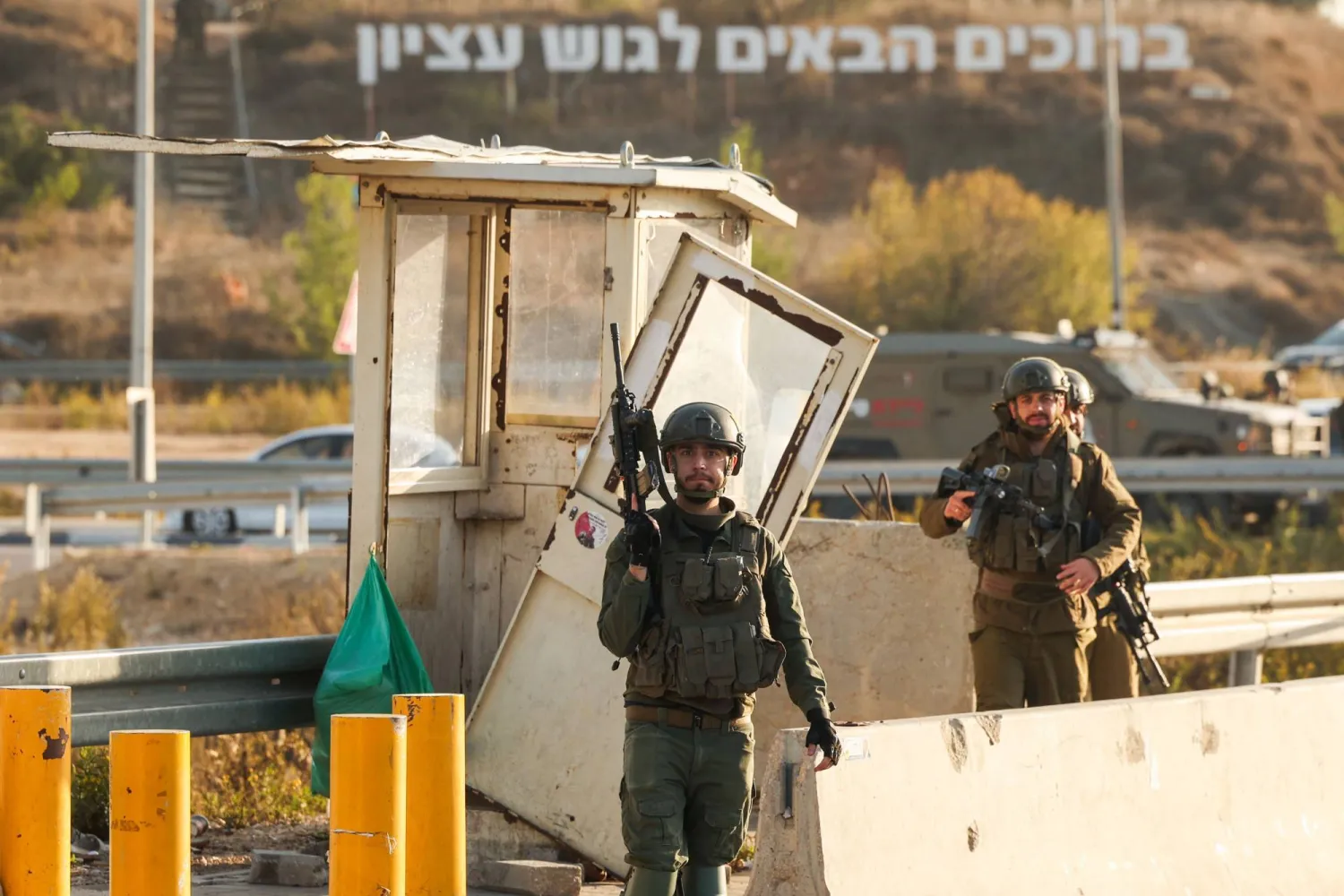 Israeli soldiers secure the site of a reported attack at the Gush Etzion Junction, in the Israeli-occupied West Bank, on November 18, 2025. (AFP)
