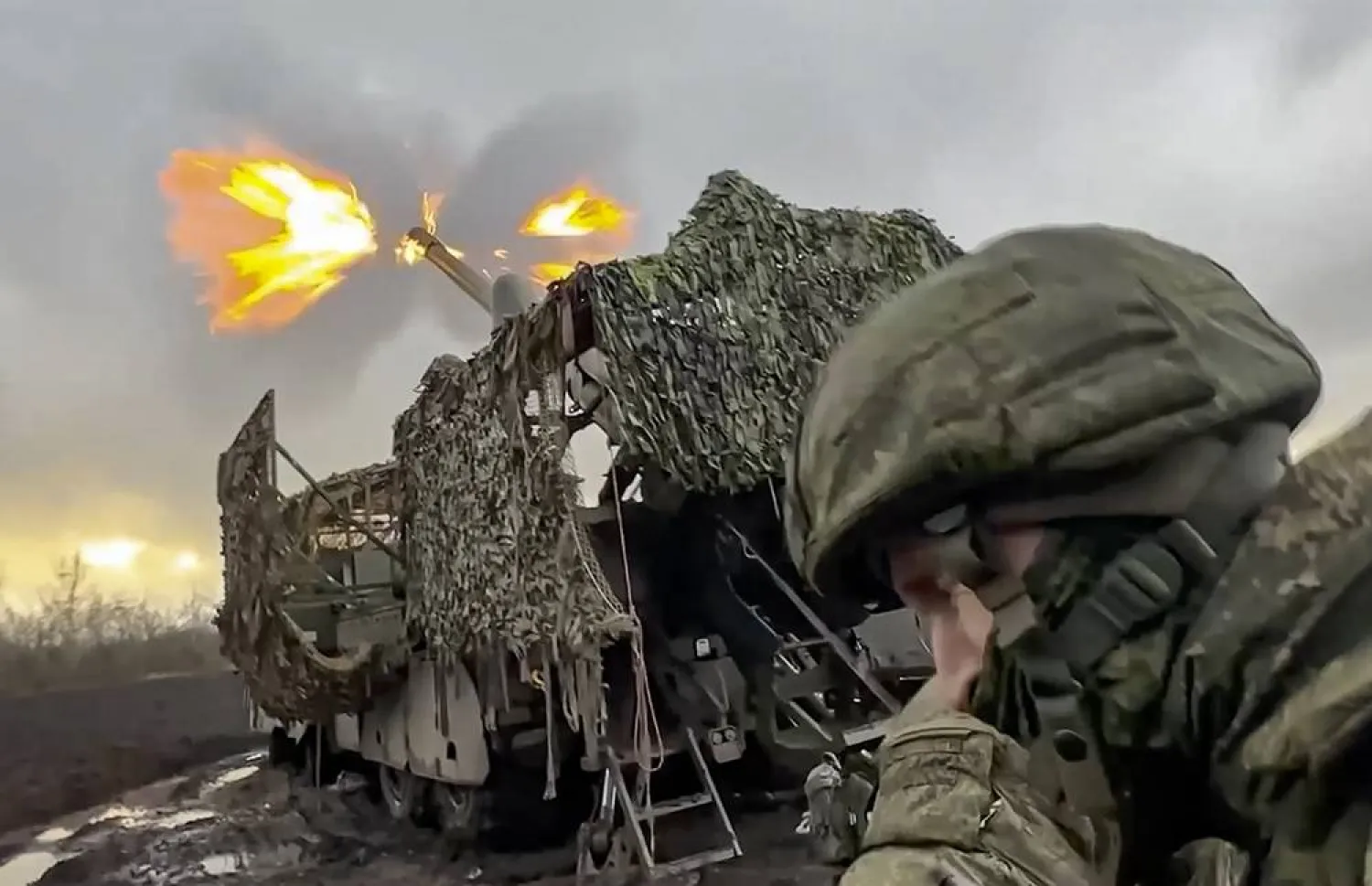 A handout still image taken from handout video provided 18 November 2025, by the Russian Defense Ministry press-service shows a Russian serviceman firing a new Russian 152mm truck-mounted self-propelled howitzer “Malva” towards Ukrainian army positions at an undisclosed location in Ukraine. (EPA/Russian Defense Ministry Press Service/Handout)  