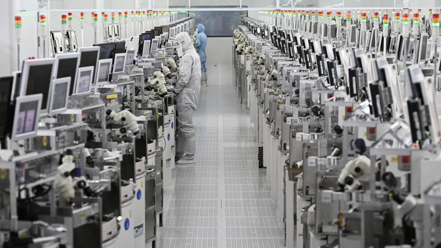 While AI-led demand is surging, chip-makers are also winding back spending on capacity, which is keeping prices elevated. STR / AFP
