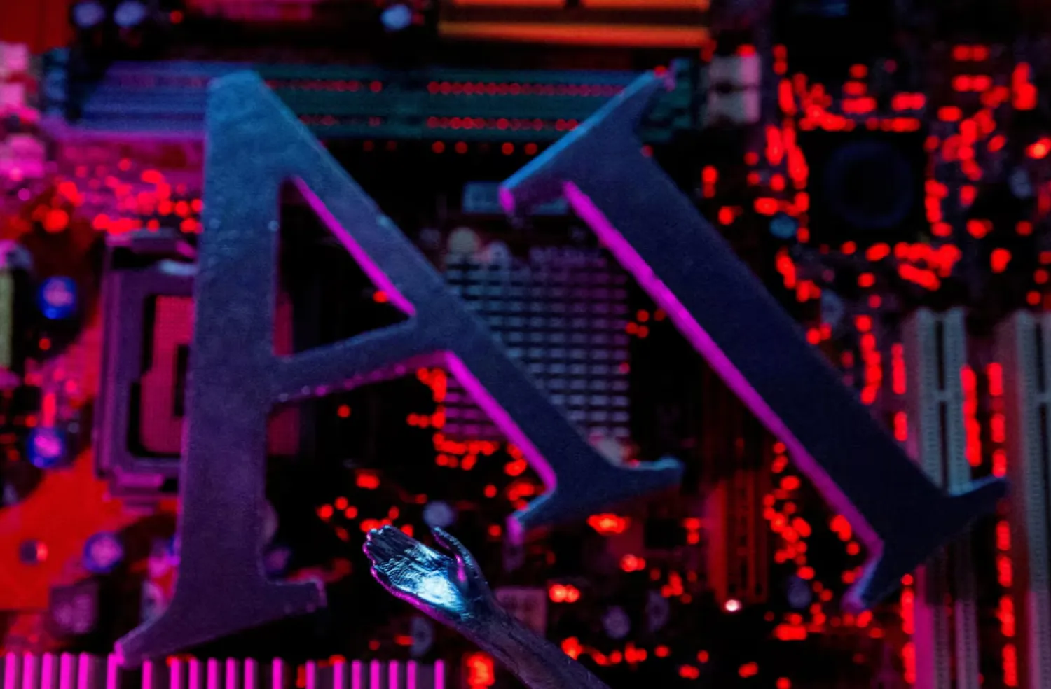 AI (Artificial Intelligence) letters and robot hand are placed on computer motherboard in this illustration created on June 23, 2023. REUTERS/Dado Ruvic/Illustration/File Photo