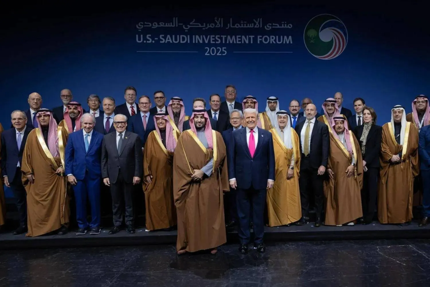 WASHINGTON, DC - NOVEMBER 19: Crown Prince and Prime Minister Mohammed bin Salman of Saudi Arabia and US President Donald Trump stand for a photo with other participants at the US-Saudi Investment Forum at the Kennedy Center on November 19, 2025 in Washington, DC. Win McNamee/Getty Images/AFP 