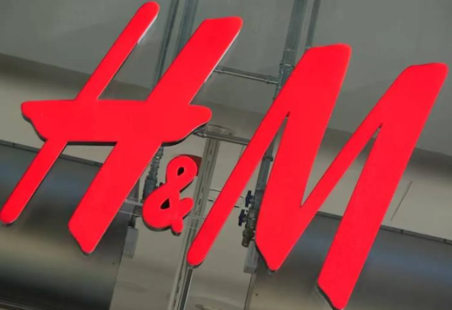 The logo for H&M is displayed outside a store in Stockholm, Sweden, September 23, 2025. REUTERS/Tom Little
