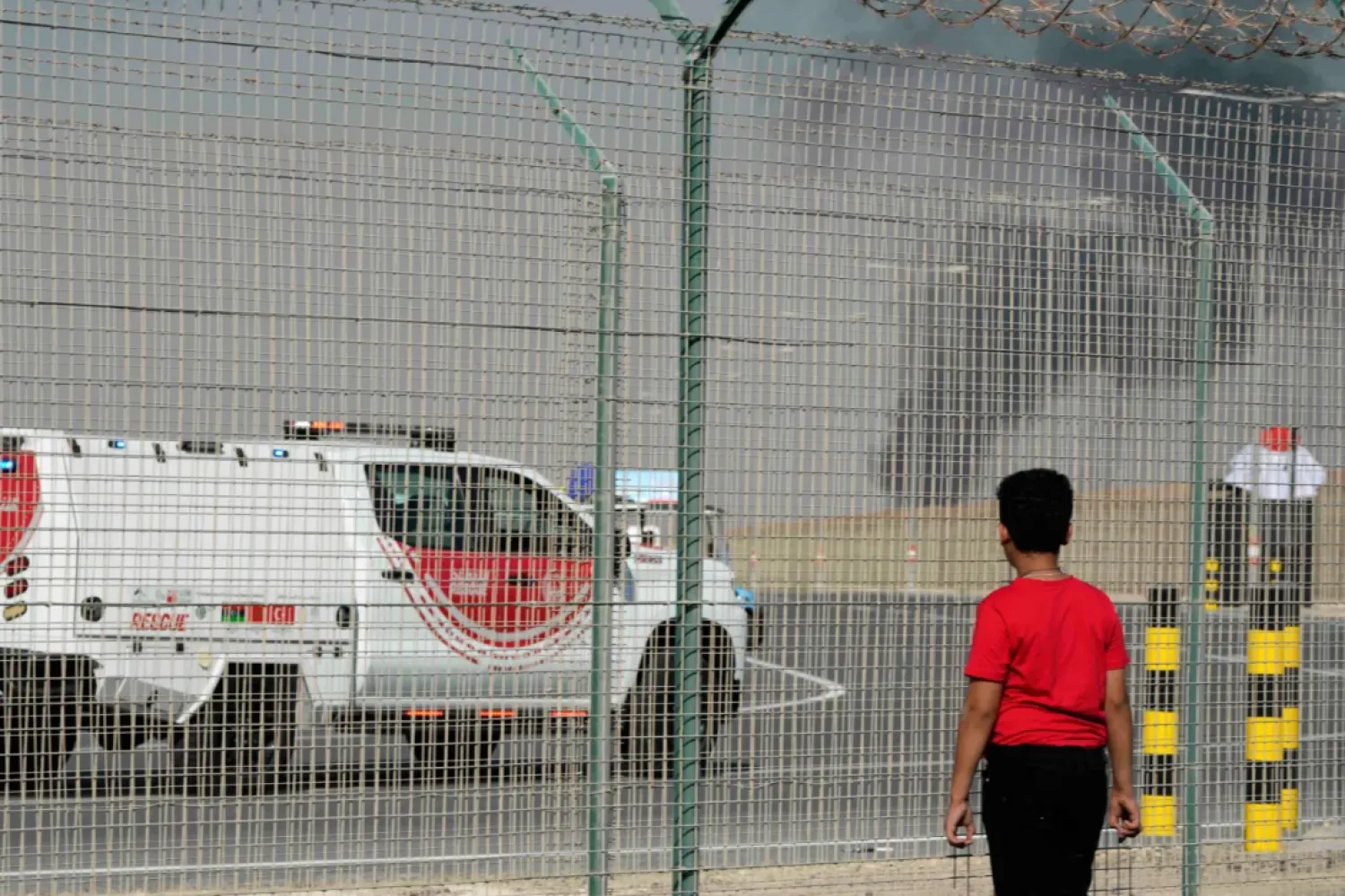 A passerby looks at the wreckage of the Indian aircraft during the Dubai Airshow (AP).
