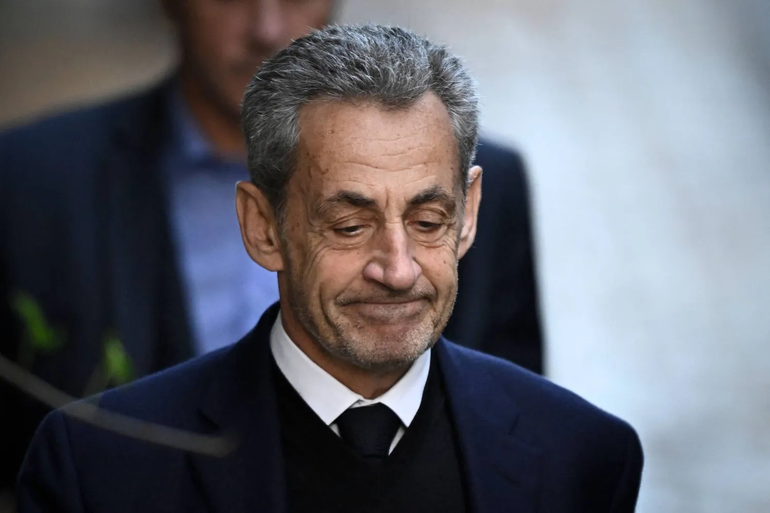 France's former president Nicolas Sarkozy leaves his residence to present himself to La Sante Prison for incarceration in Paris, on October 21, 2025. (AFP)