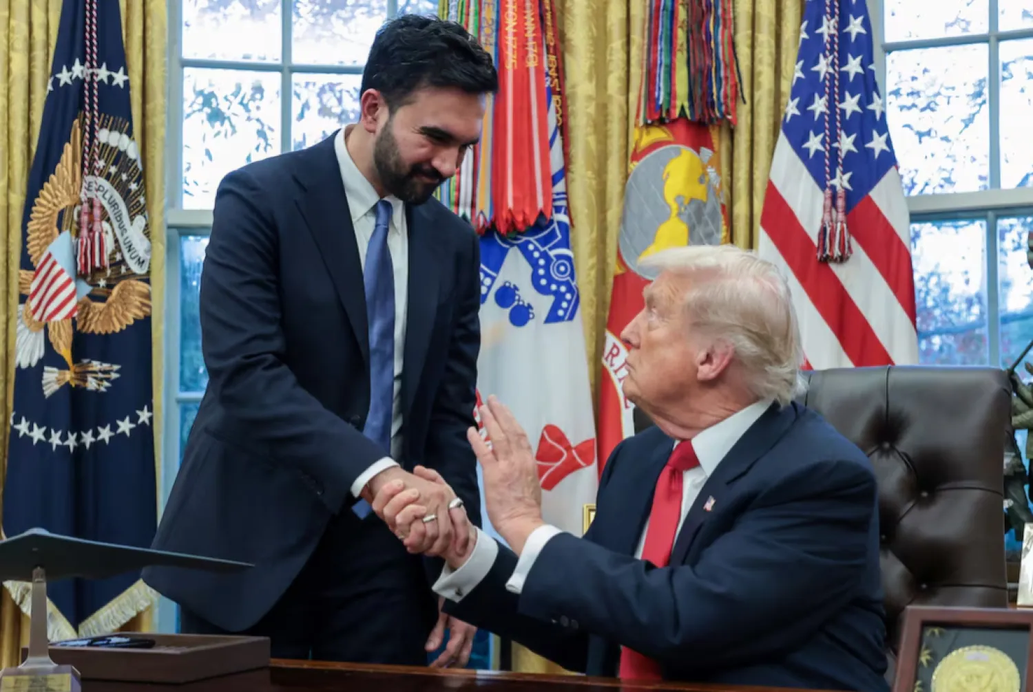 US President Donald Trump and New York City Mayor-elect Zohran Mamdani shake hands as they meet in the Oval Office at the White House in Washington, D.C., US, November 21, 2025. REUTERS/Jonathan Ernst 
