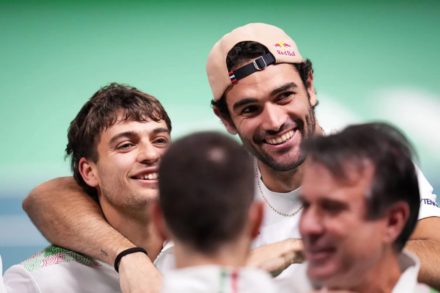 21 November 2025, Italy, Bologna: Italian tennis player Flavio Cobolli (L) celebrates with compatriot Matteo Berrettini after defeating Belgium's Zizou Bergs during the 2025 Davis Cup semifinal match between Italy and Belgium at Bologna Fiere. Photo: Massimo Paolone/LaPresse via ZUMA Press/dpa