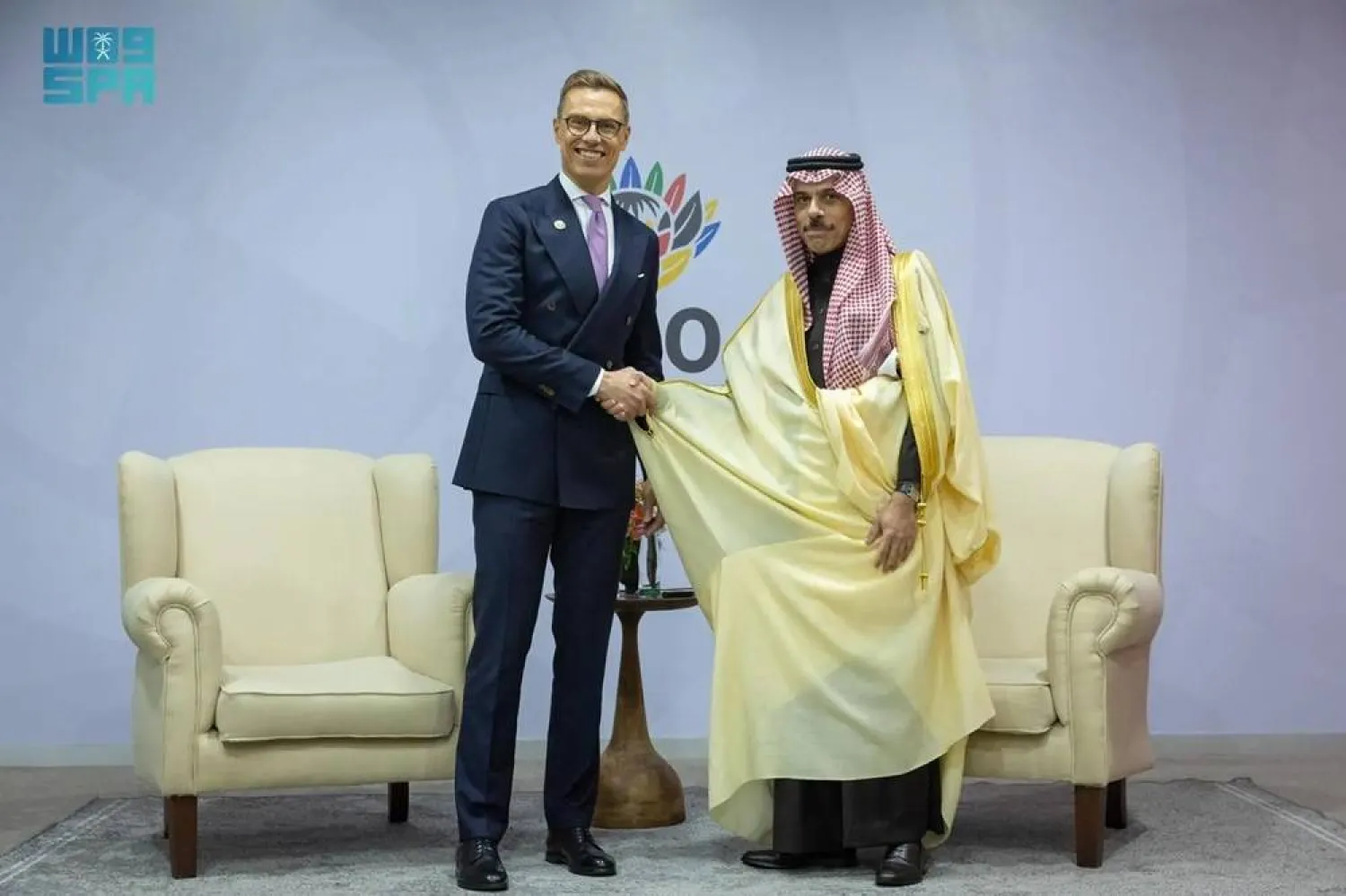 Saudi Minister of Foreign Affairs Prince Faisal bin Farhan bin Abdullah shakes hands with President of Finland Alexander Stubb on the sidelines of the G20 Leaders' Summit in Johannesburg on Sunday. (SPA)