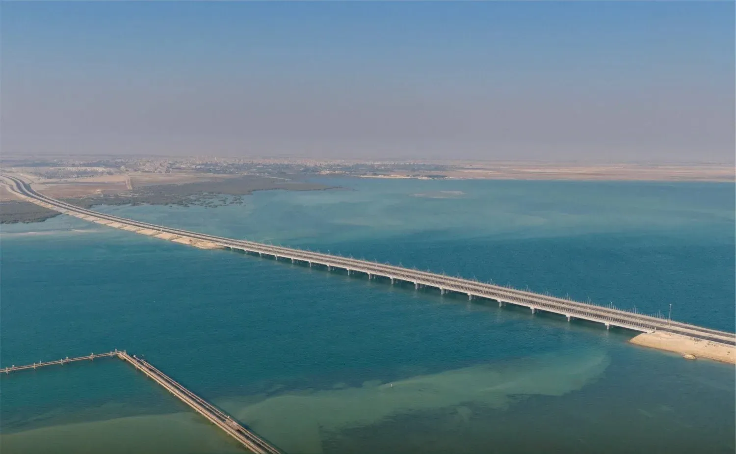 The 15-km marine bridge linking Safwa in Qatif Governorate with Ras Tanura (Saudi Projects). 