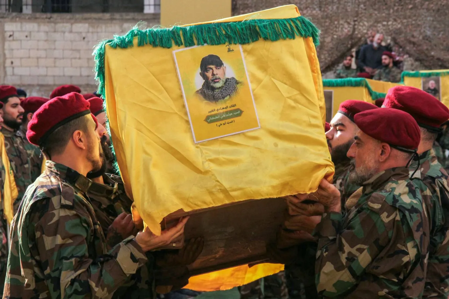 Comrades carry the coffin of top Hezbollah military chief Haytham Tabatabai during his funeral in Beirut's southern suburbs on November 24, 2025. (AFP)