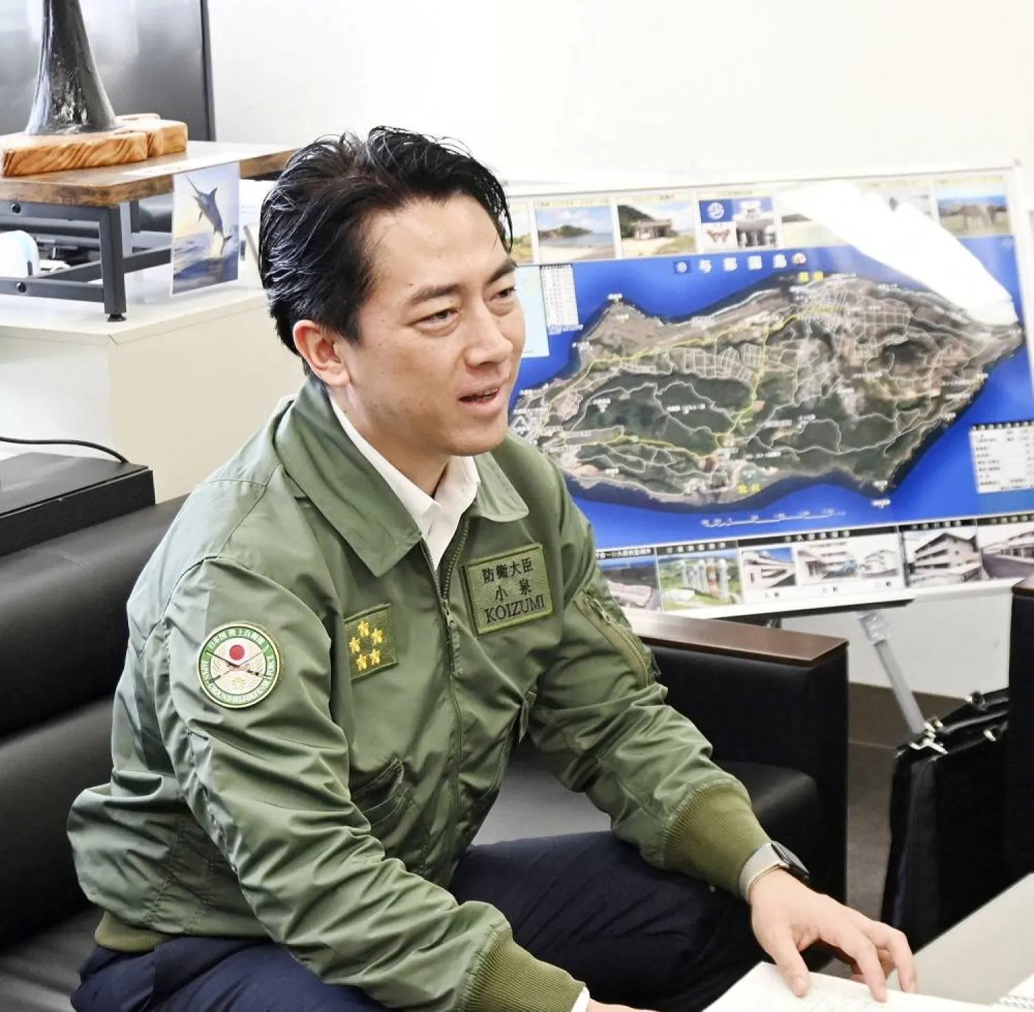 Japan's Defense Minister Shinjiro Koizumi meets with Yonaguni town mayor Tsuneo Uechi (not in picture) at Yonaguni town hall, on Yonaguni island, Japan's westernmost inhabited island in Okinawa prefecture, Japan November 23, 2025, in this photo taken by Kyodo. (Kyodo/via Reuters) 