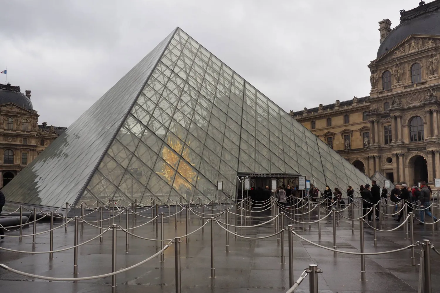 07 December 2018, France, Paris: A view of the inner courtyard with the glass pyramid of the Louvre Museum in Paris. (dpa)