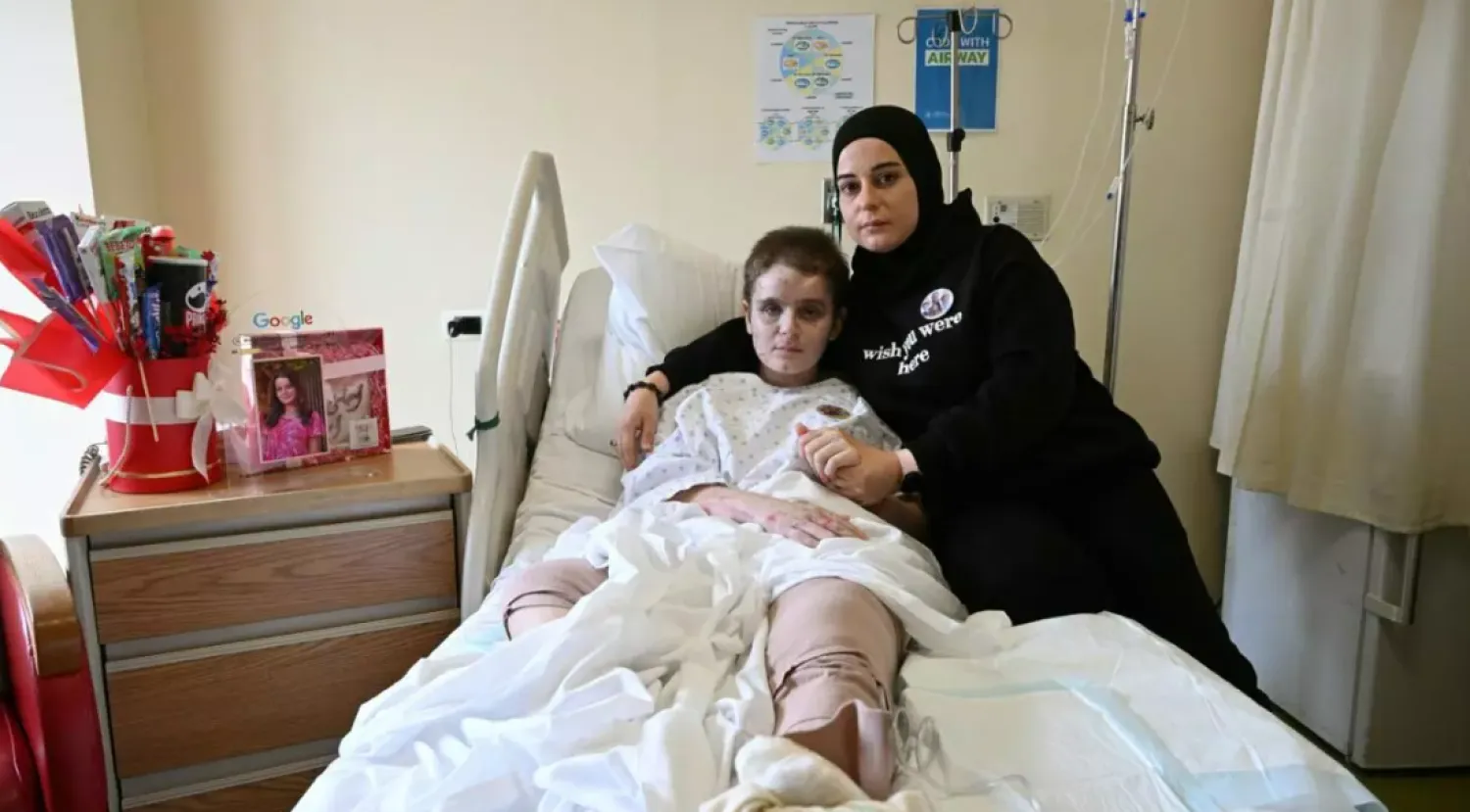 Amani Bazzi and her daughter Aseel survived an Israeli strike in south Lebanon that killed four members of their family © Joseph EID / AFP
