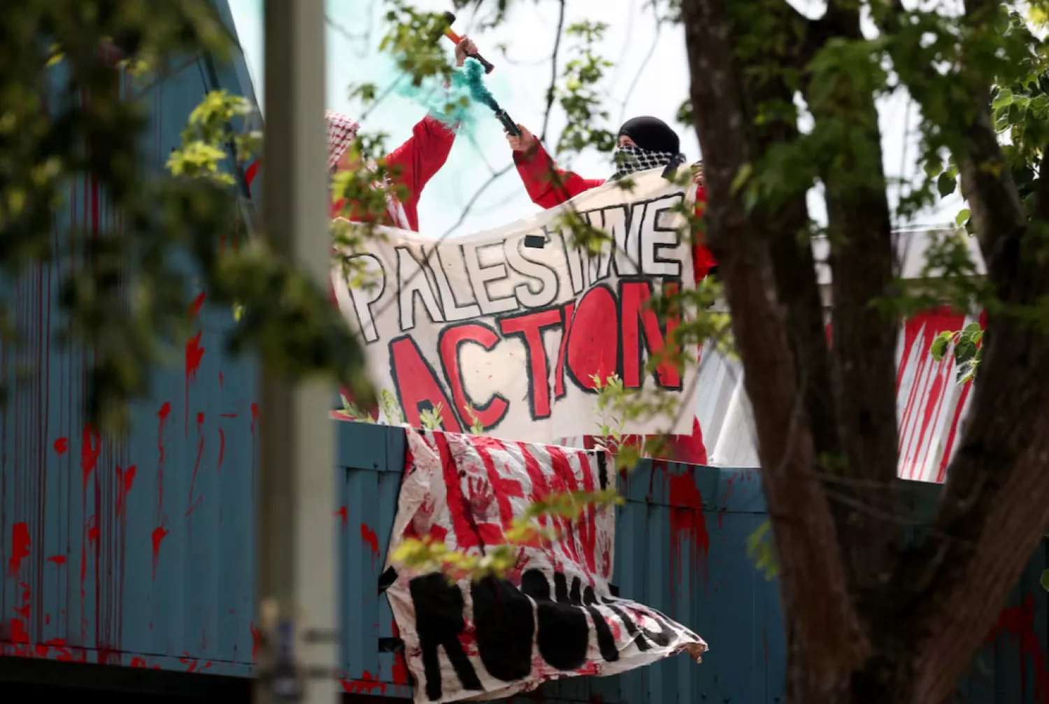 Protesters from "Palestine Action" demonstrate on the roof of Guardtech Group in Brandon, Suffolk, Britain, July 1, 2025. REUTERS/Chris Radburn 