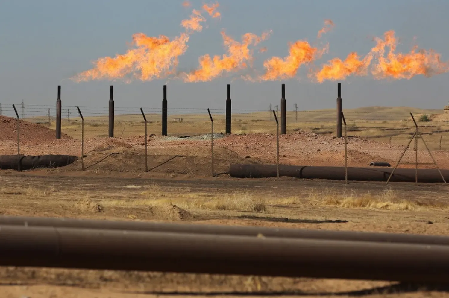 This file photo taken on October 17, 2017 shows excess flammable gasses burning from gas flares at the Bai Hassan oil field, west of the multi-ethnic northern Iraqi city of Kirkuk. (AFP)
