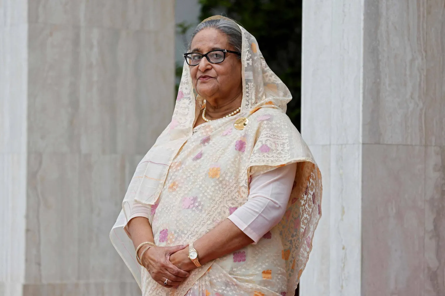 (FILES) This picture taken on September 11, 2023, shows Bangladesh's Prime Minister Sheikh Hasina awaiting the arrival of France's President Emmanuel Macron (not pictured) at the Prime Minister's office during his two-day visit in Dhaka. (Photo by Ludovic MARIN / AFP)