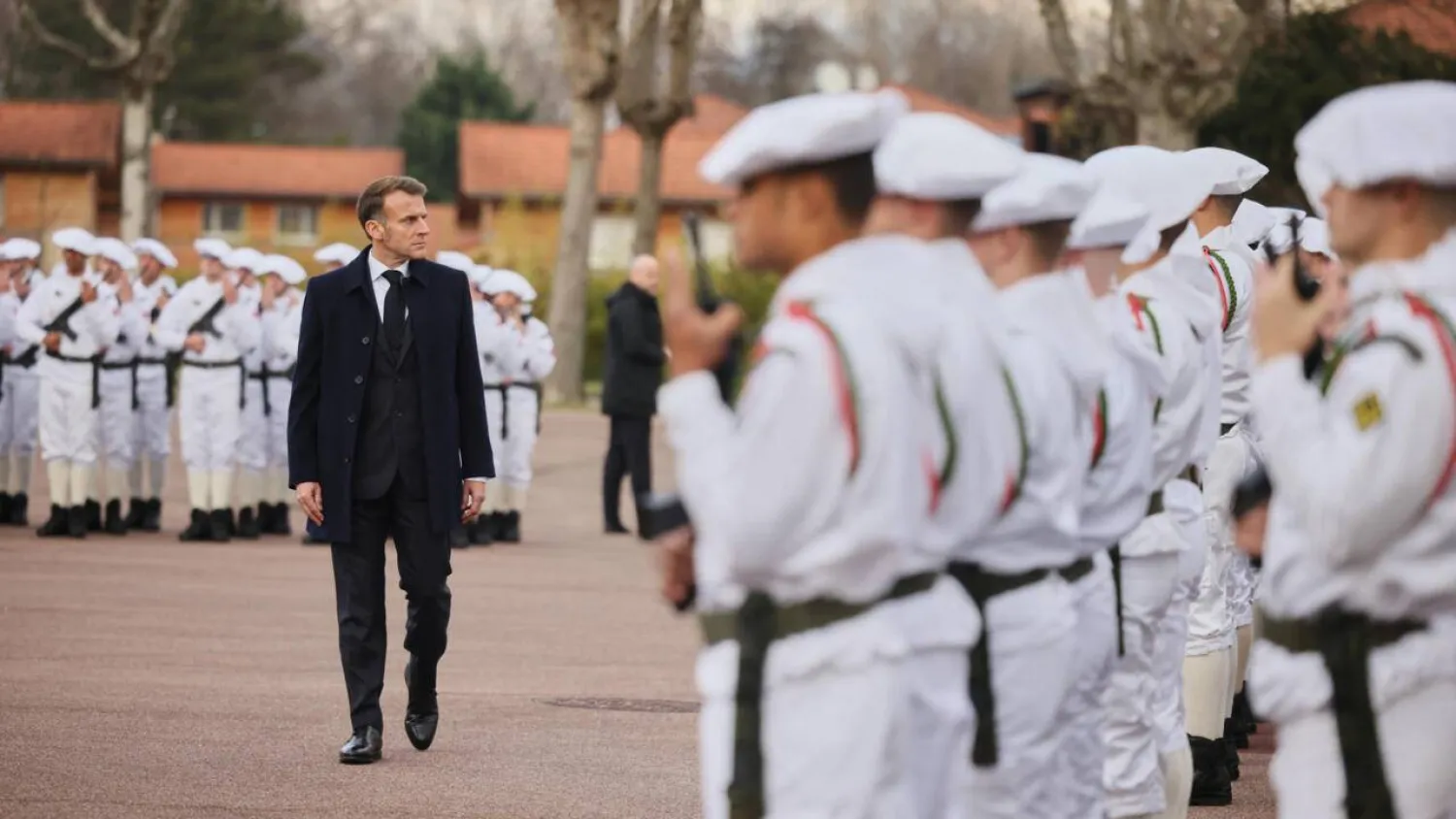 France's President Emmanuel Macron reviews the troops prior to unveiling a new national military service in a speech at an army base in the French on November 27, 2025. Pool via Reuters
