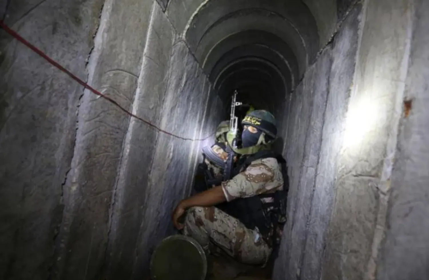 A Palestinian fighter from the Islamic Jihad's armed wing, the Al-Quds Brigades, is seen in a tunnel in the south of the Gaza Strip (AFP)
