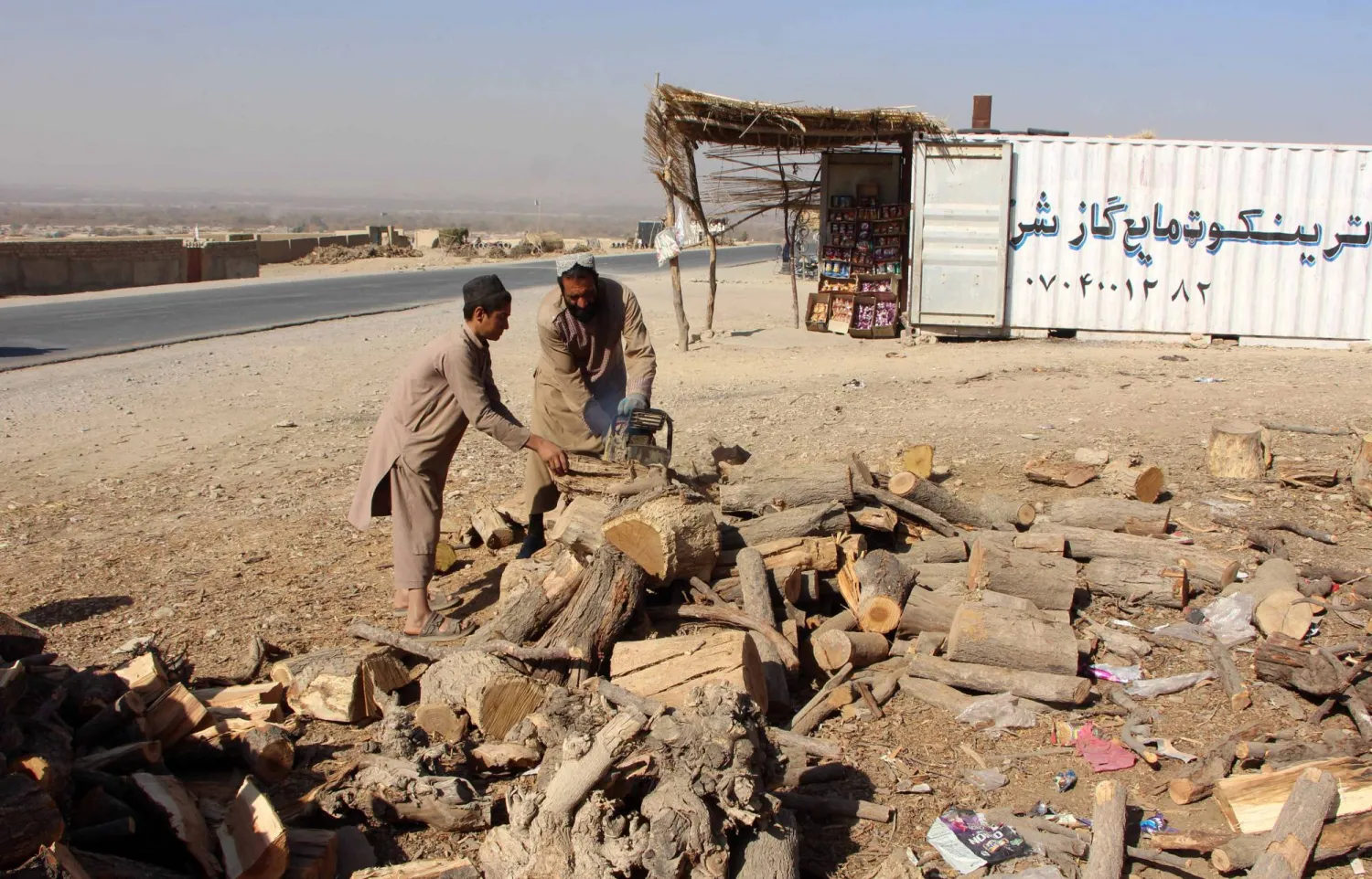 A man chops firewood in a rural Afghan area as families prepare fuel supplies ahead of the winter season in Kandahar, Afghanistan, 25 November 2025. EPA/QUDRATULLAH RAZWAN