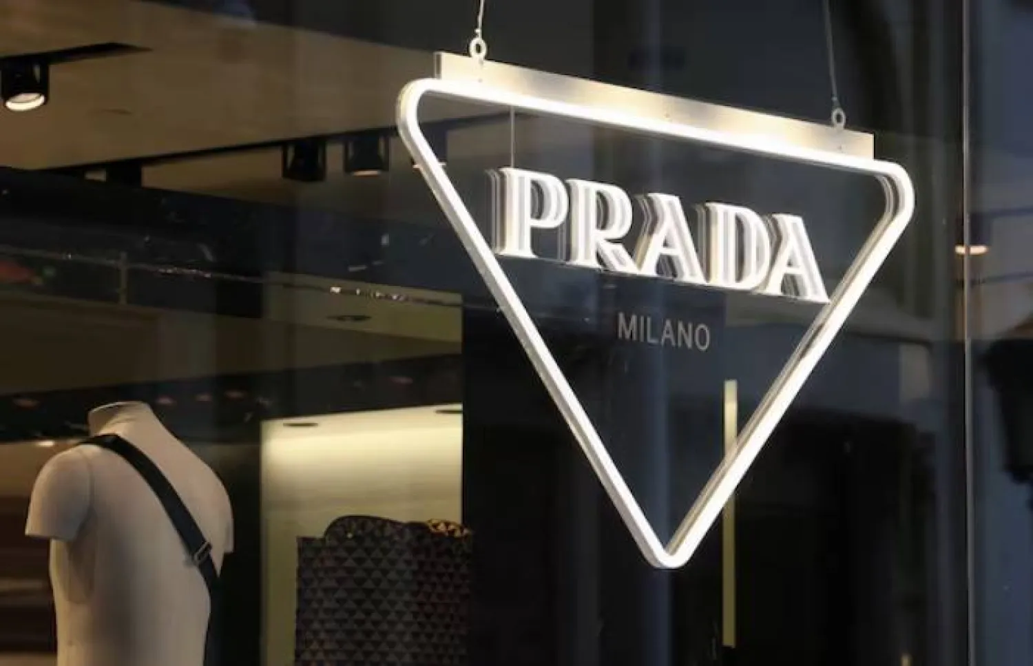 The logo of Prada is seen in a shop in Paris, France, February 12, 2023. REUTERS/Yves Herman/File Photo 