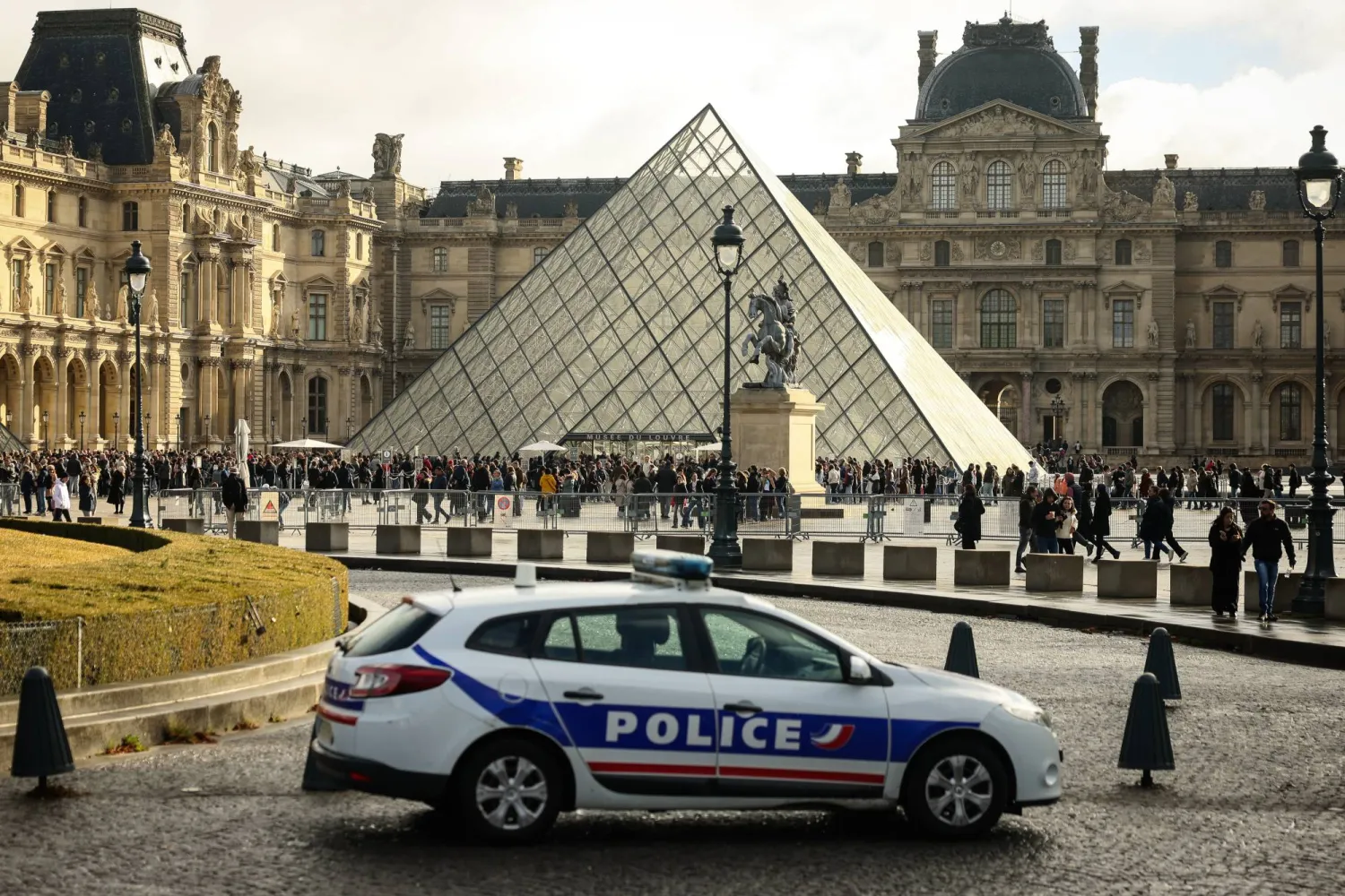 A police car parks in the courtyard of the Louvre museum, one week after the robbery, on Oct. 26, 2025, in Paris. (AP) 