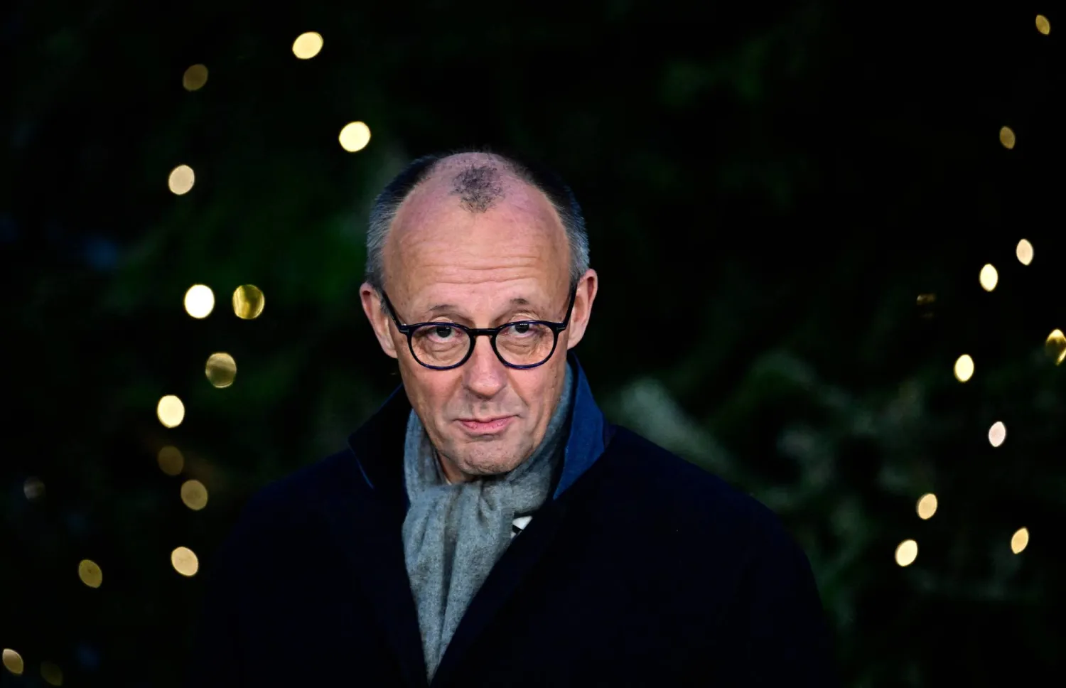  German Chancellor Friedrich Merz attends an official event to hand over the Christmas tree for the Chancellery, on November 28, 2025 in front of the Chancellery in Berlin. (AFP) 