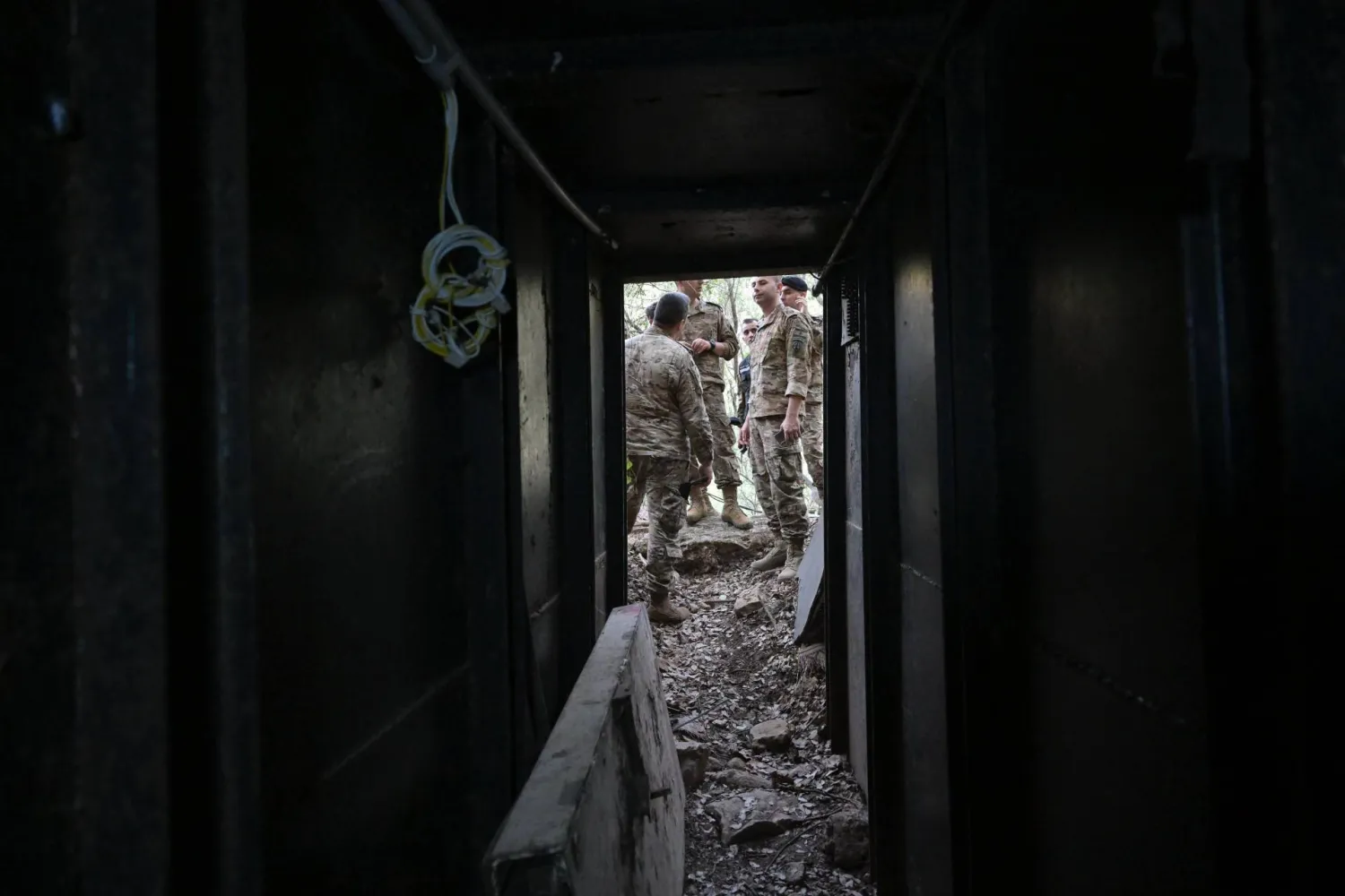 Members of the army are seen at the entrance of a tunnel in Zibqin. (Asharq Al-Awsat) 