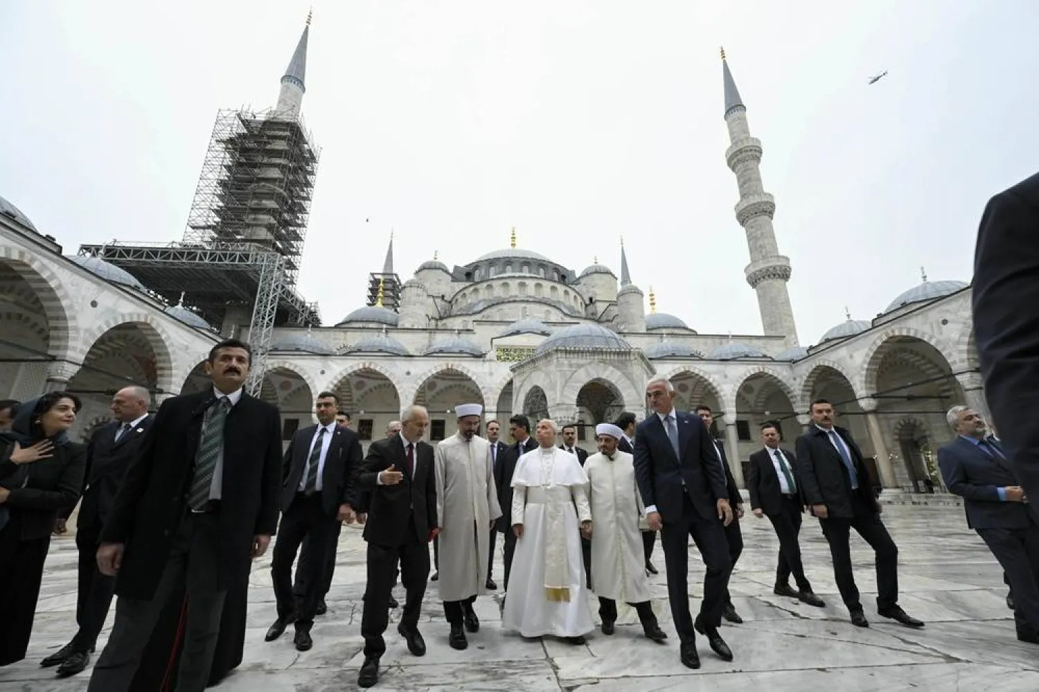 A handout picture provided by the Vatican Media shows Pope Leo XIV (C) during a visit to the Sultan Ahmed Mosque (The Blue Mosque) in Istanbul, Türkiye, 29 November 2025. (EPA/Vatican Media) 
