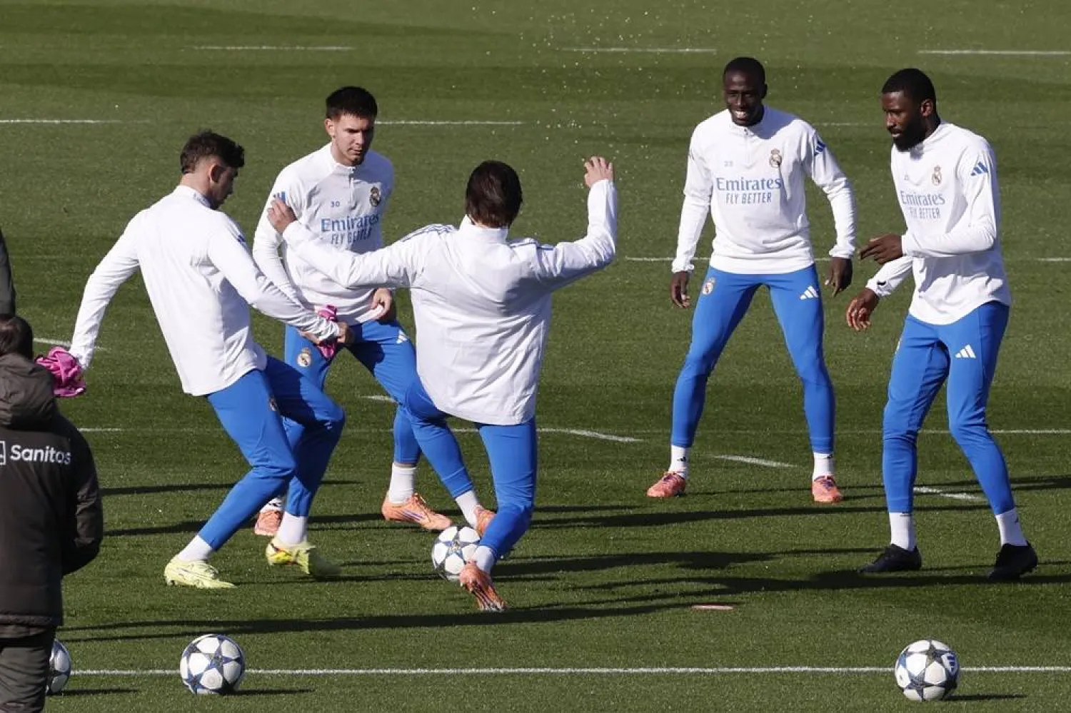Real Madrid's Franco Mastantuono (2L), Ferland Mendy (2R) ans Antonio Rudiger (R) during team's training session at Valdebebas Sports Complex in Madrid, Spain, 25 November 2025. Real Madrid will face Olympiacos F.C. in the UEFA Champions League match on 26 November. (EPA)