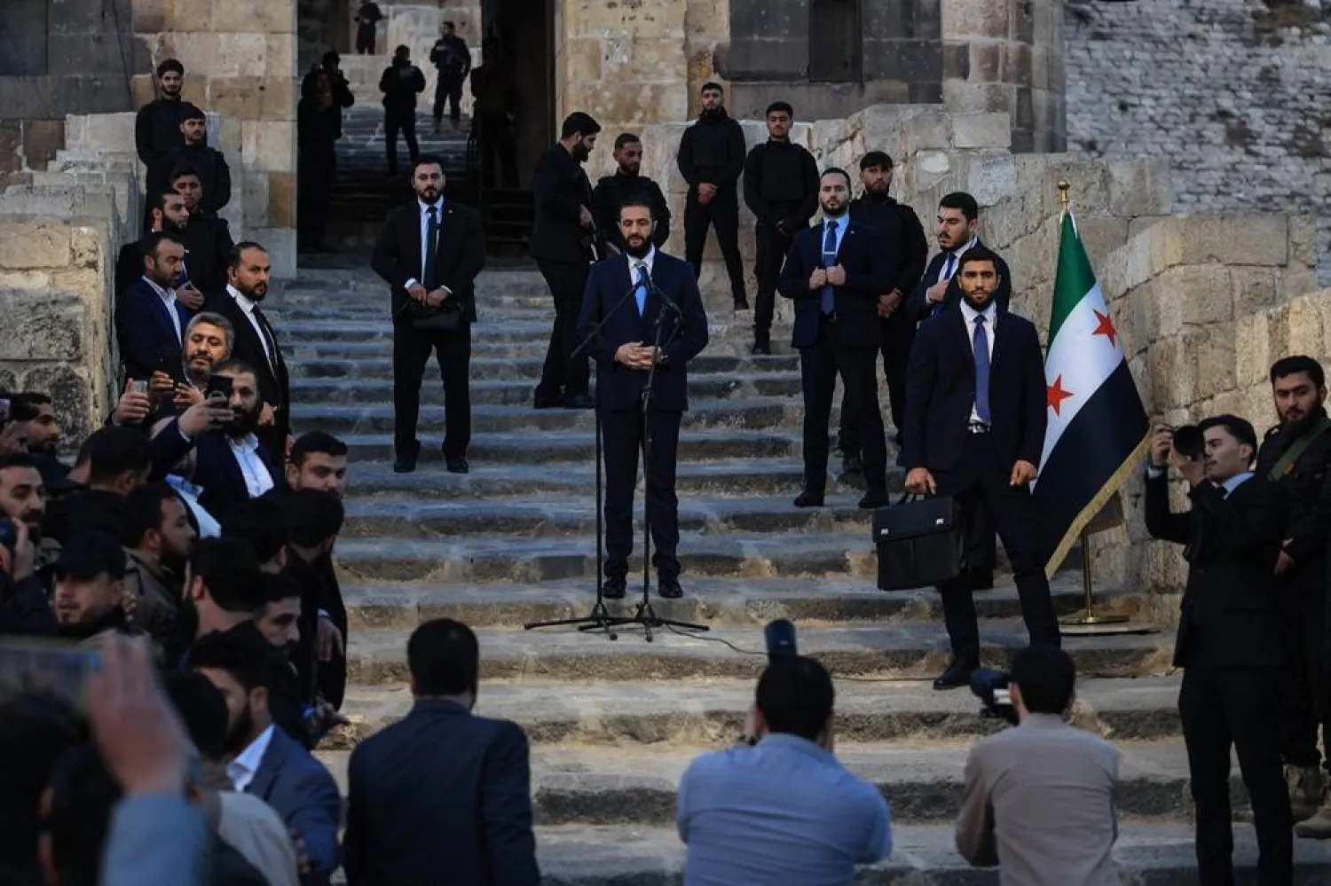 Syrian President Ahmed al-Sharaa delivers a speech at the gate of Aleppo’s citadel during celebrations marking one year since an opposition alliance, led by Sharaa, entered the northern city and swiftly took control of it, on November 29, 2025. (AFP) 