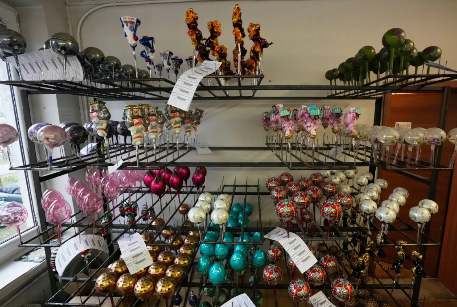 The hand-made Christmas baubles are prepared at GlitterLab in Czestochowa, southern Poland, on Nov. 21, 2025. (AP Photo/Czarek Sokolowski)