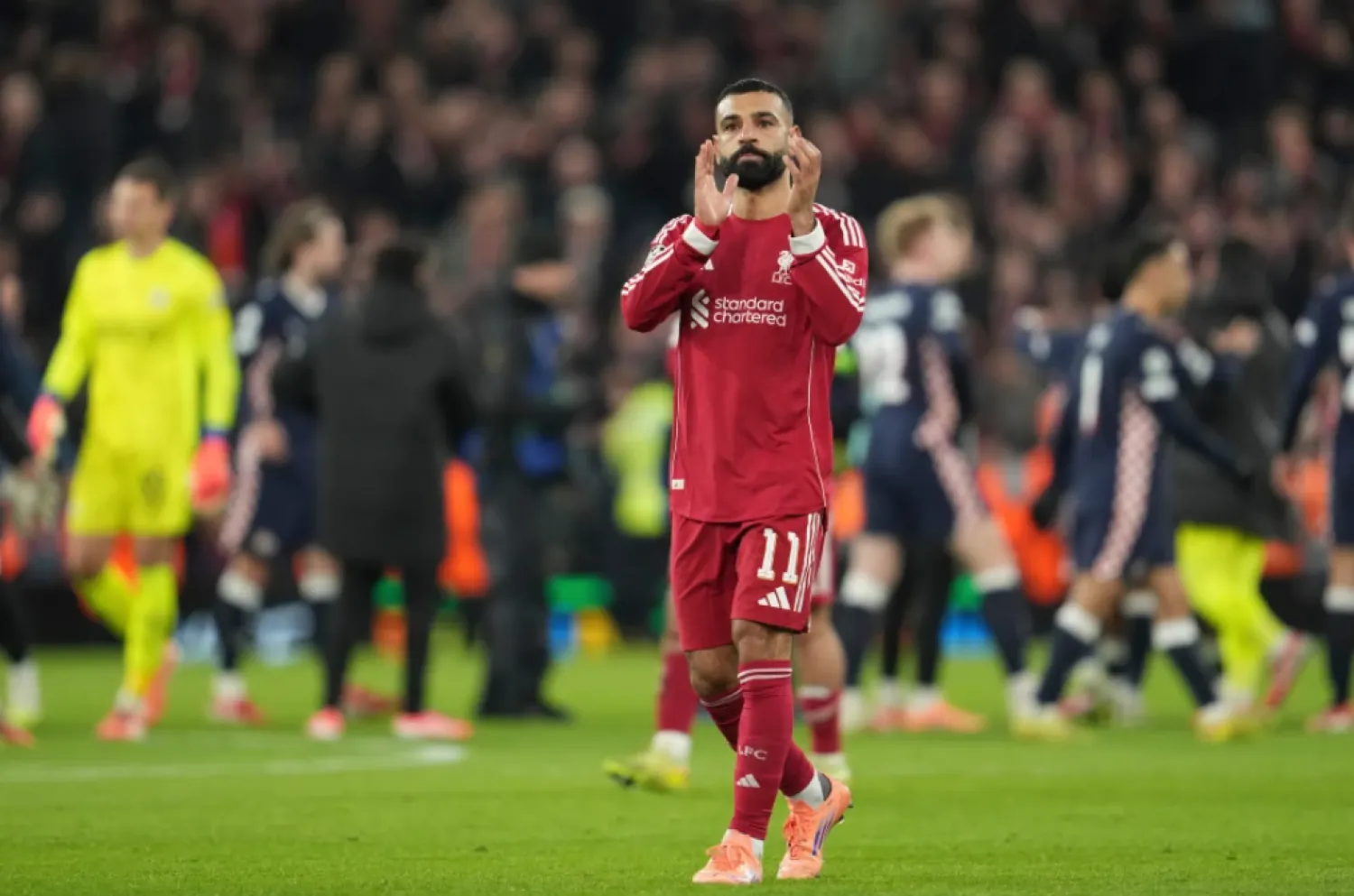 Liverpool’s Mohamed Salah applauds after the Champions League opening phase soccer match between Liverpool and PSV in Liverpool, England, Wednesday, Nov. 26, 2025. (AP Photo/Jon Super)

