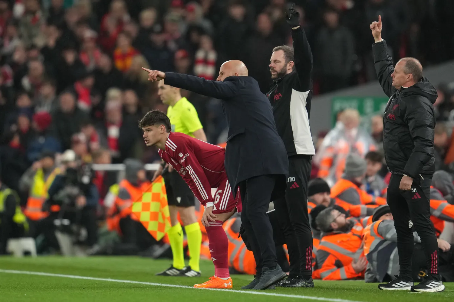 Liverpool's manager Arne Slot brings in Milos Kerkez during the Champions League soccer match between Liverpool and Real Madrid in Liverpool, England, Tuesday, Nov. 4, 2025. (AP Photo/Jon Super)
