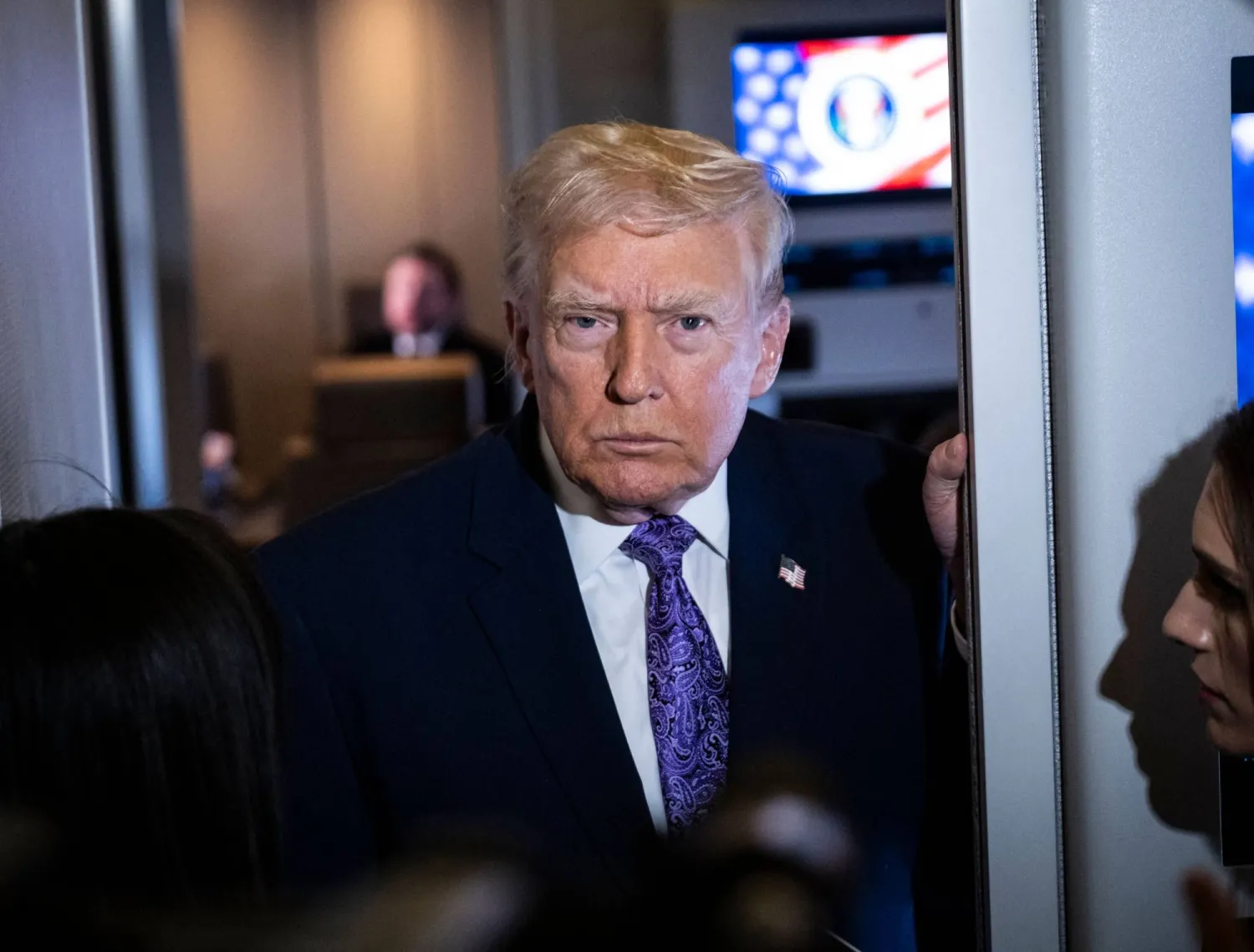 President Donald Trump speaks to the press aboard Air Force One en-route to Washington, DC on November 30, 2025. (Getty Images via AFP) 