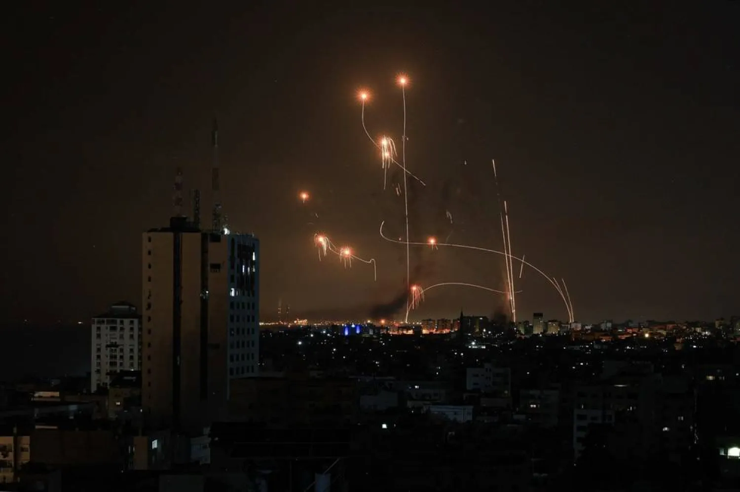 An Israeli missile launched from an Iron Dome system attempts to intercept a rocket over Netivot, Israel, on Sunday. (AFP via Getty Images)