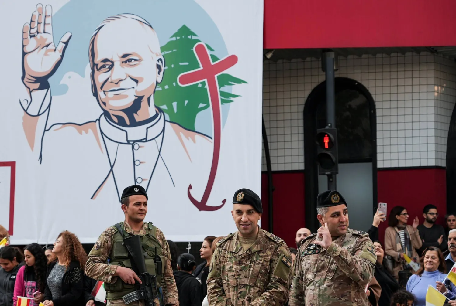 Crowds gather while security personnel stand guard, as Pope Leo XIV visits the country during his first apostolic journey, in Jal el-Dib, Lebanon December 2, 2025. REUTERS/Raghed Waked