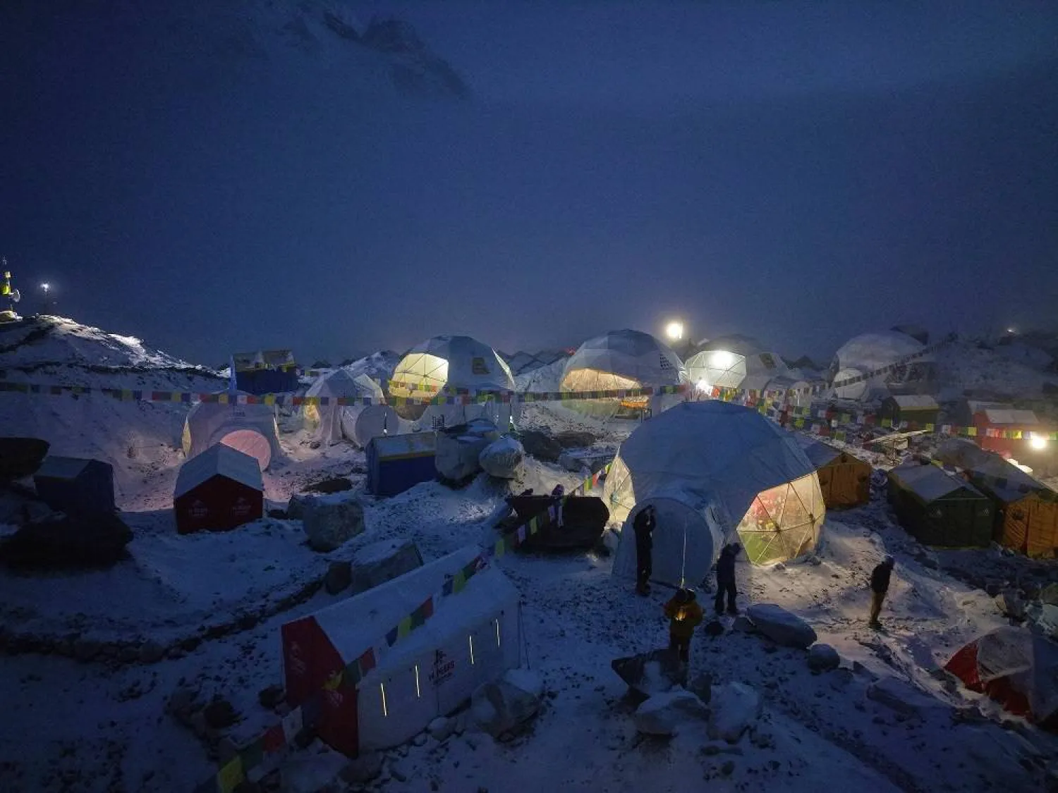 Members of an expedition to reach the summit of Mount Everest stand by their tents at the Everest Base Camp in Nepal on April 28, 2025. (AP)