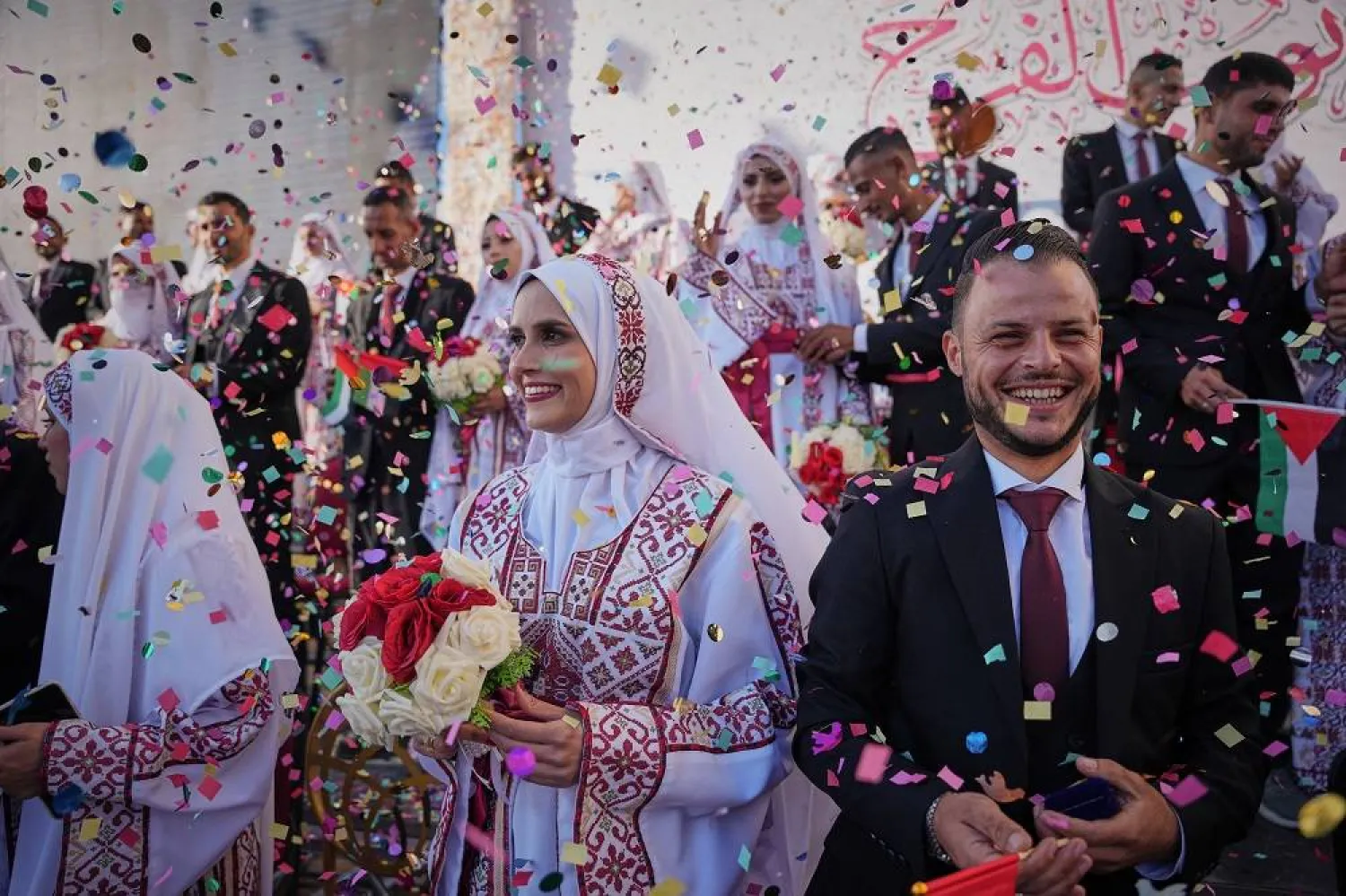 Palestinian couples participate in a mass wedding ceremony in Hamad City in Khan Younis, Gaza Strip, Tuesday, Dec. 2, 2025. (AP) 