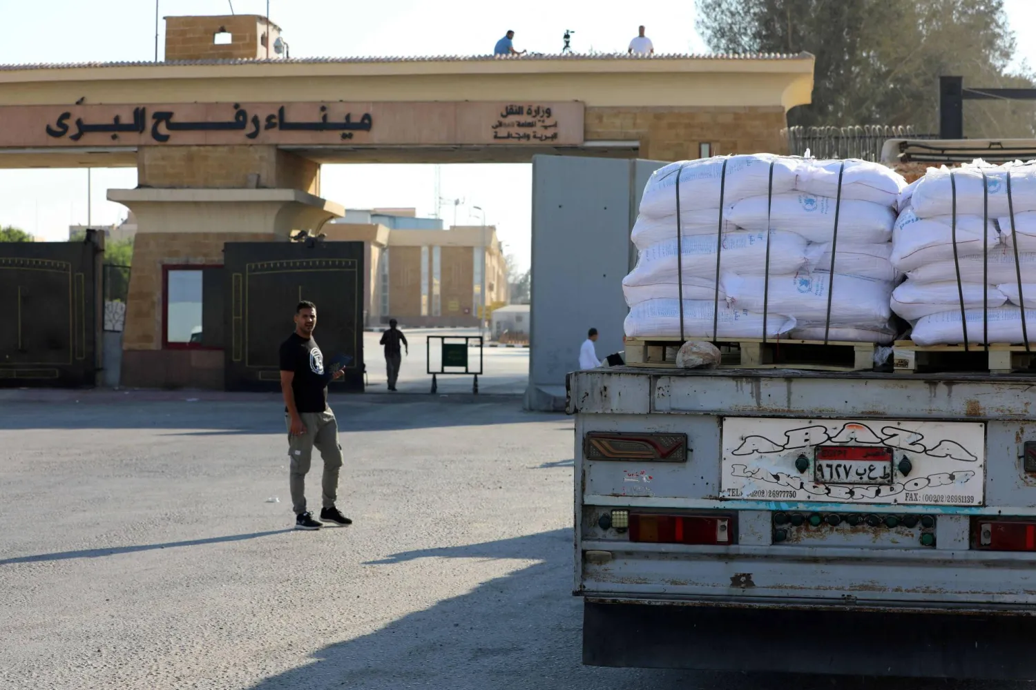 (FILES) A truck loaded with humanitarian aid awaits permission on the Egyptian side of the Rafah crossing with the Gaza Strip, to drive toward the besieged Palestinians territory on July 27, 2025. (Photo by AFP)