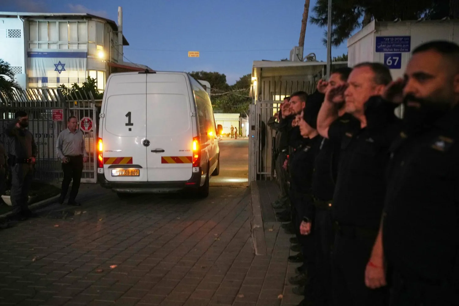 A vehicle carrying the remains of a person whom Hamas claims is a deceased hostage, transferred earlier today by Hamas to Israeli authorities, arrives at the Abu Kabir Forensic Institute in Tel Aviv, Israel, Tuesday, Dec. 2, 2025. (AP Photo/Ohad Zwigenberg)