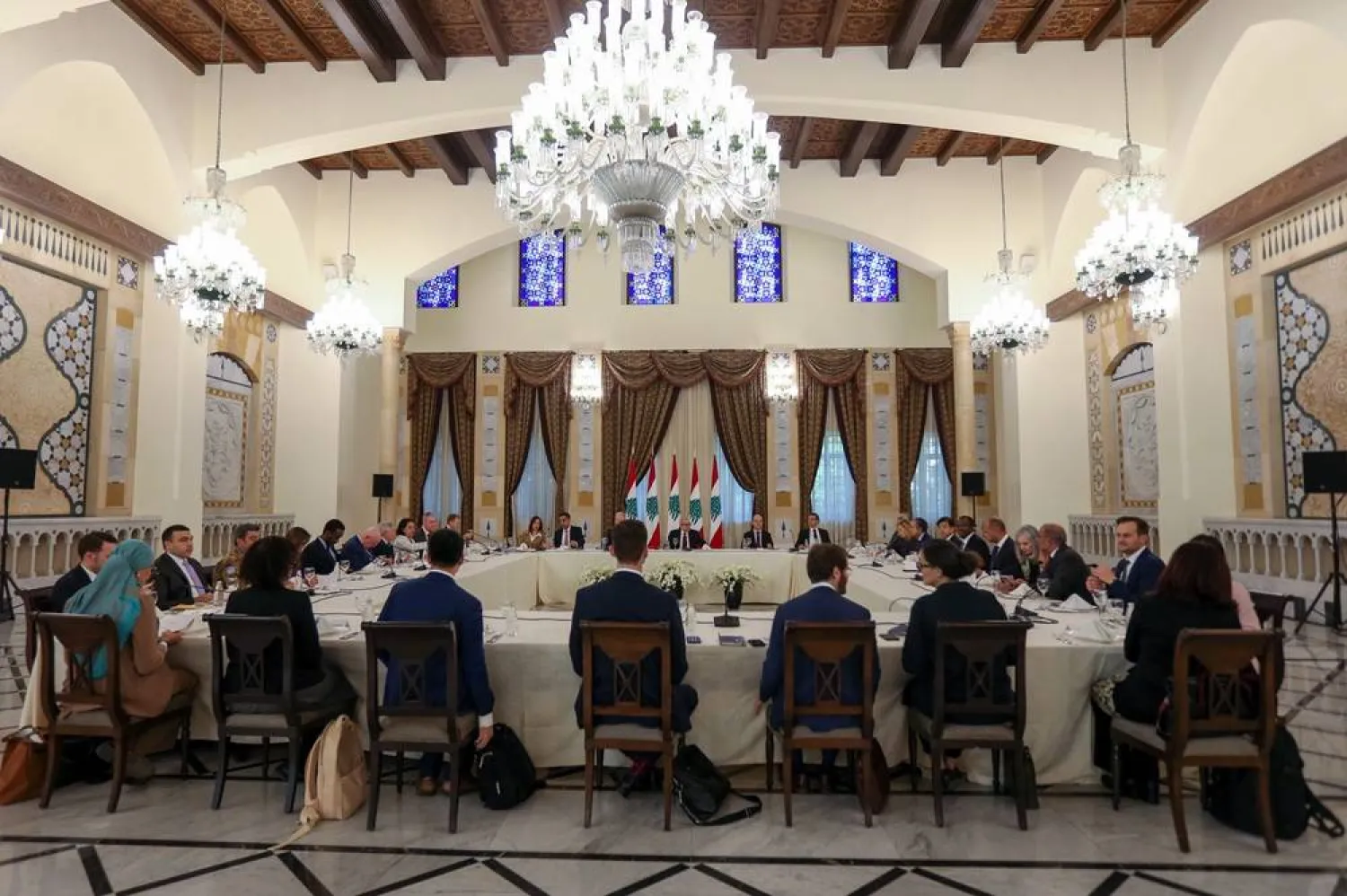 Lebanese Prime Minister Nawaf Salam, in front of the Lebanese flags (C), meets with a United Nations Security Council delegation at the government palace in Beirut, Lebanon, 05 December 2025. (EPA)