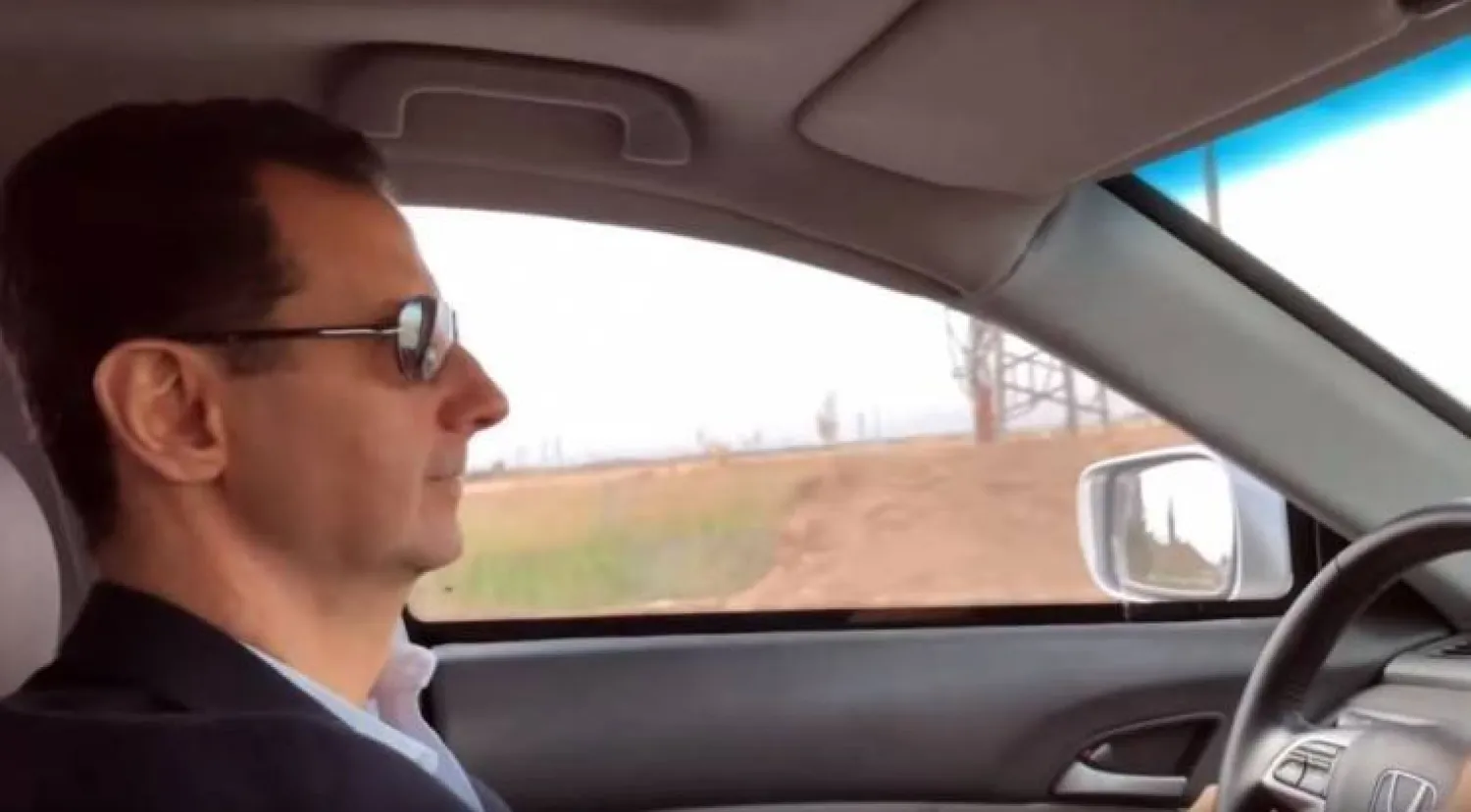 بشار الأسد يقود سيارته في الغوطة الشرقية في 2018 (أرشيفية - متداول)