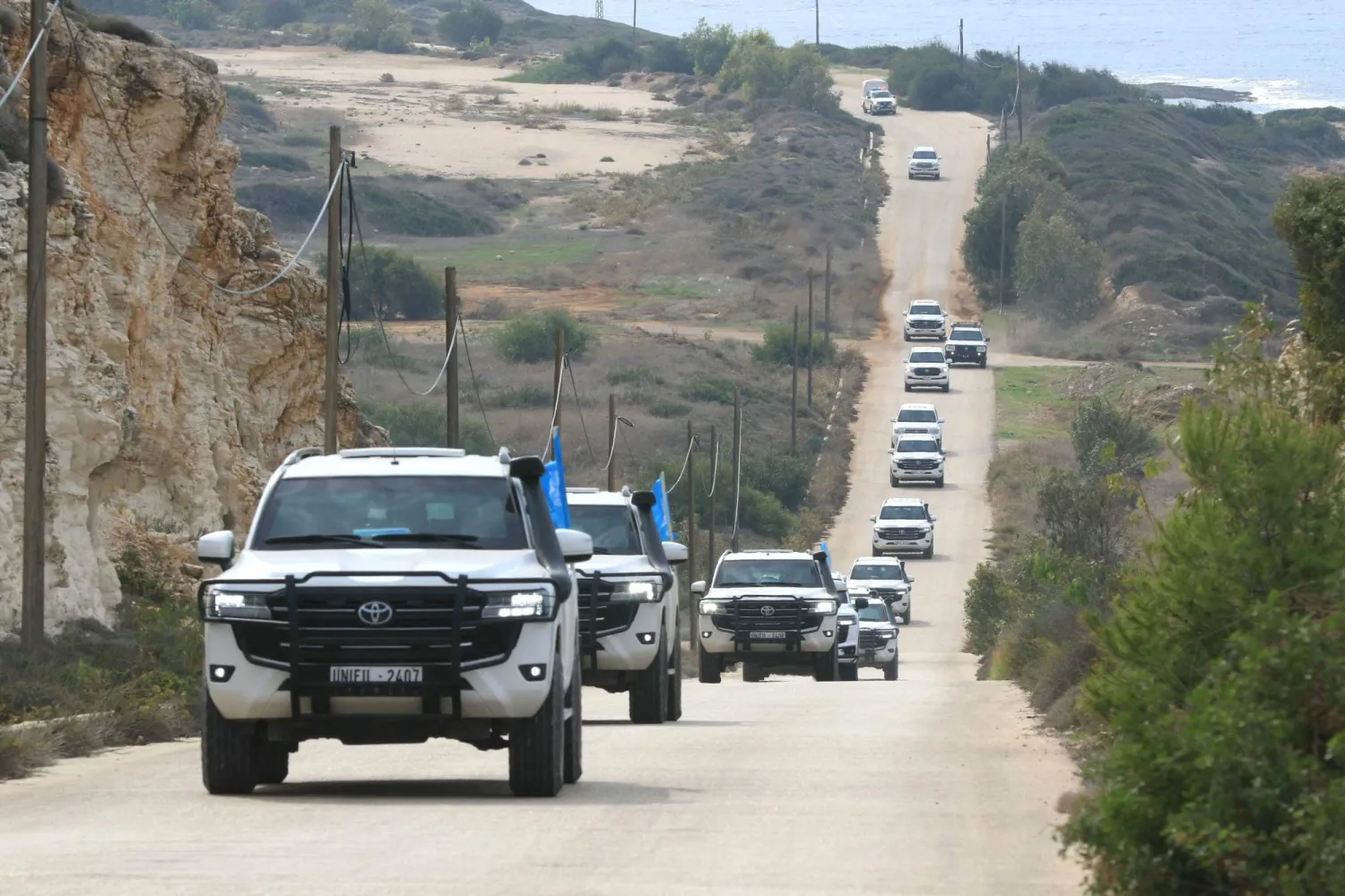 A convoy carrying a UN Security Council delegation, tours the border with Israel close to the southern Lebanese area of Naqura on December 6, 2025. (Photo by Mahmoud ZAYYAT / AFP)