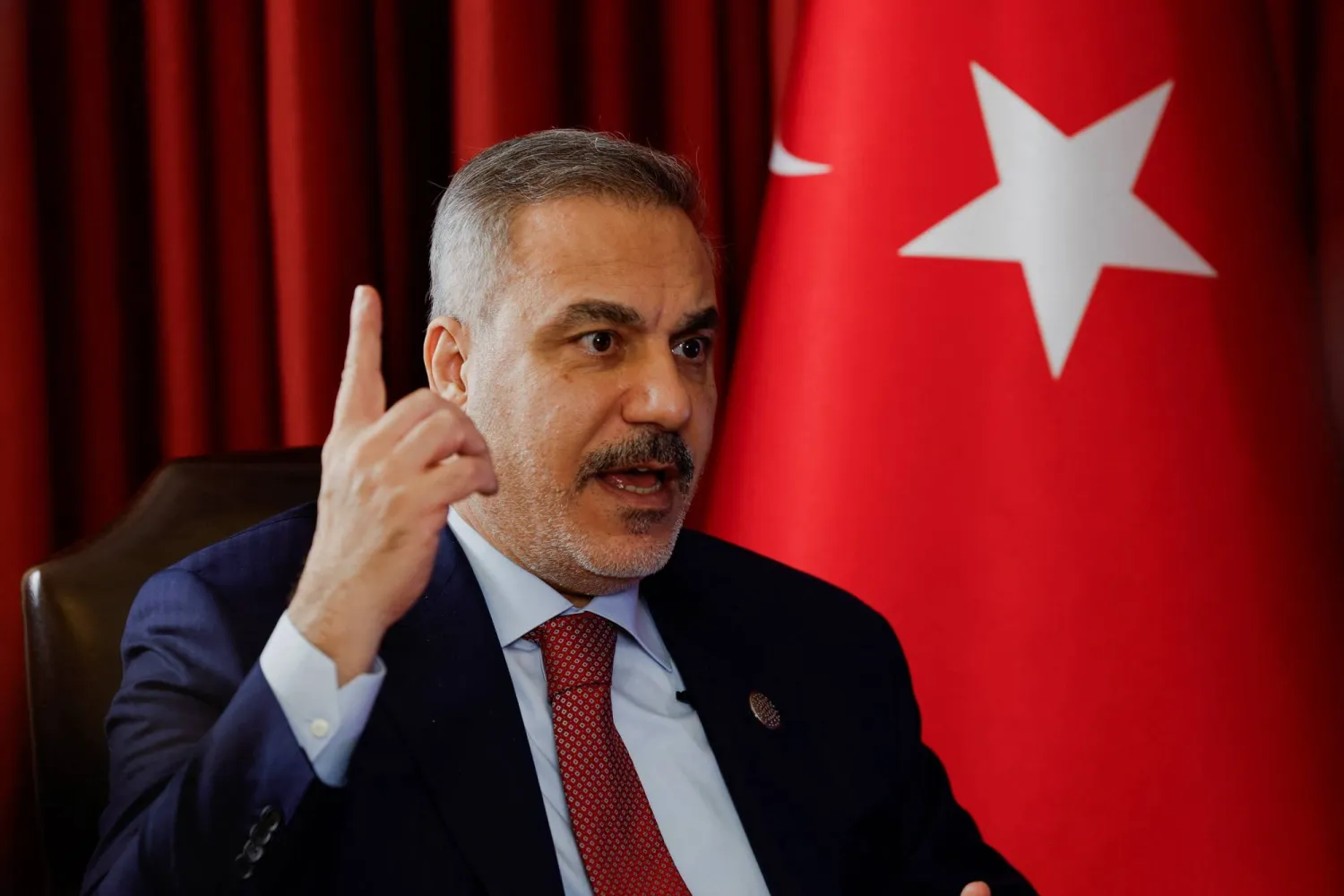 Turkish Foreign Minister Hakan Fidan speaks during an interview with Reuters at the 23rd edition of the annual Doha Forum, in Doha, Qatar, December 6, 2025. REUTERS/Ibraheem Abu Mustafa