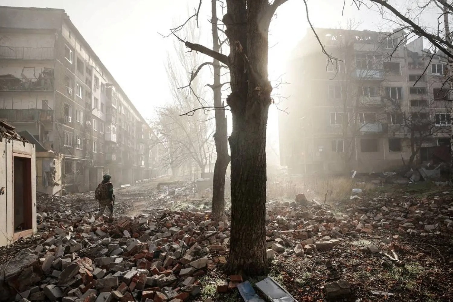 A Ukrainian serviceman walks near apartment buildings damaged by a Russian military strike, amid Russia's attack on Ukraine, in the frontline town of Kostiantynivka in Donetsk region, Ukraine November 15, 2025. (Oleg Petrasiuk/Press Service of the 24th King Danylo Separate Mechanized Brigade of the Ukrainian Armed Forces/Handout via Reuters)
