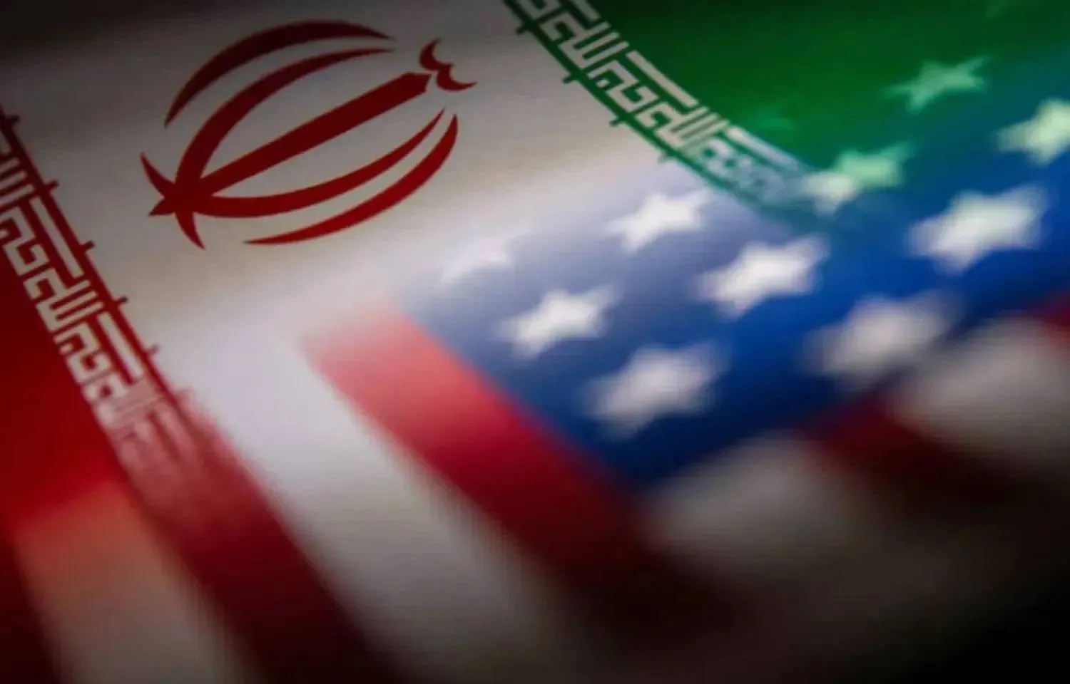 Iran's and US' flags are seen printed on paper in this illustration taken January 27, 2022. REUTERS/Dado Ruvic/Illustration/File Photo

