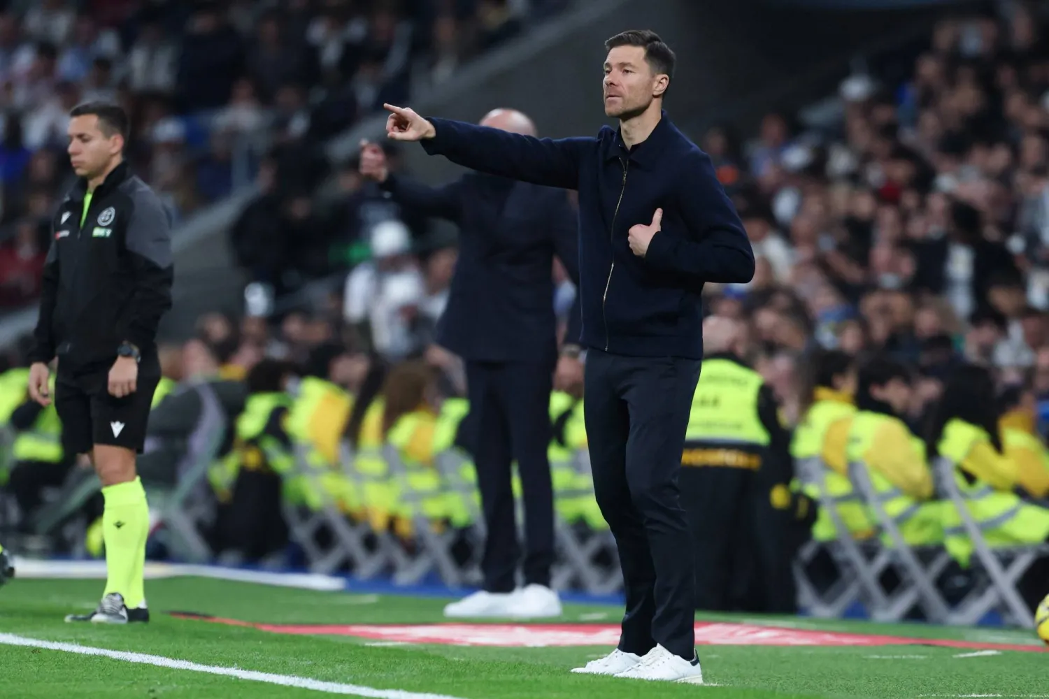 Real Madrid's Spanish coach Xabi Alonso gestures to players during the Spanish league football match between Real Madrid CF and RC Celta de Vigo at the Santiago Bernabeu Stadium in Madrid on December 7, 2025. (AFP)