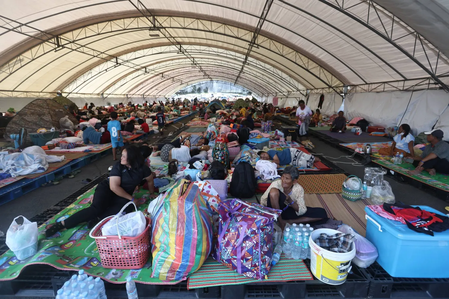 Thai residents who fled homes following clashes between Thai and Cambodian soldiers rest at an evacuation center in Buriram province, Thailand, Monday, Dec. 8, 2025. (AP)