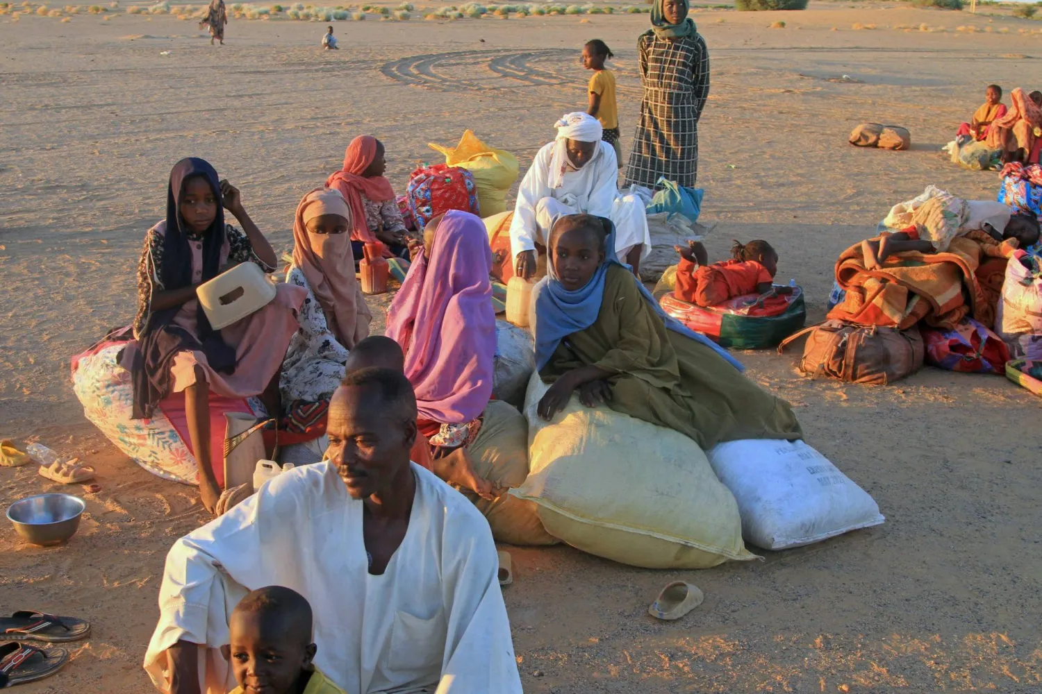 Sudanese people who fled El-Fasher rest upon their arrival at the Al-Afad camp for displaced people in the town of Al-Dabba, northern Sudan, on November 19, 2025. (Photo by Ebrahim Hamid / AFP) 