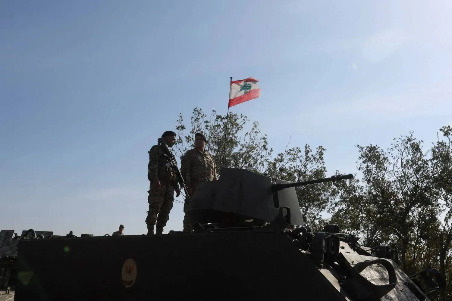 Lebanese army members stand on a military vehicle during a Lebanese army media tour, to review the army's operations in the southern Litani sector, in Alma Al-Shaab, near the border with Israel, southern Lebanon, November 28, 2025. REUTERS/Aziz Taher/File Photo 