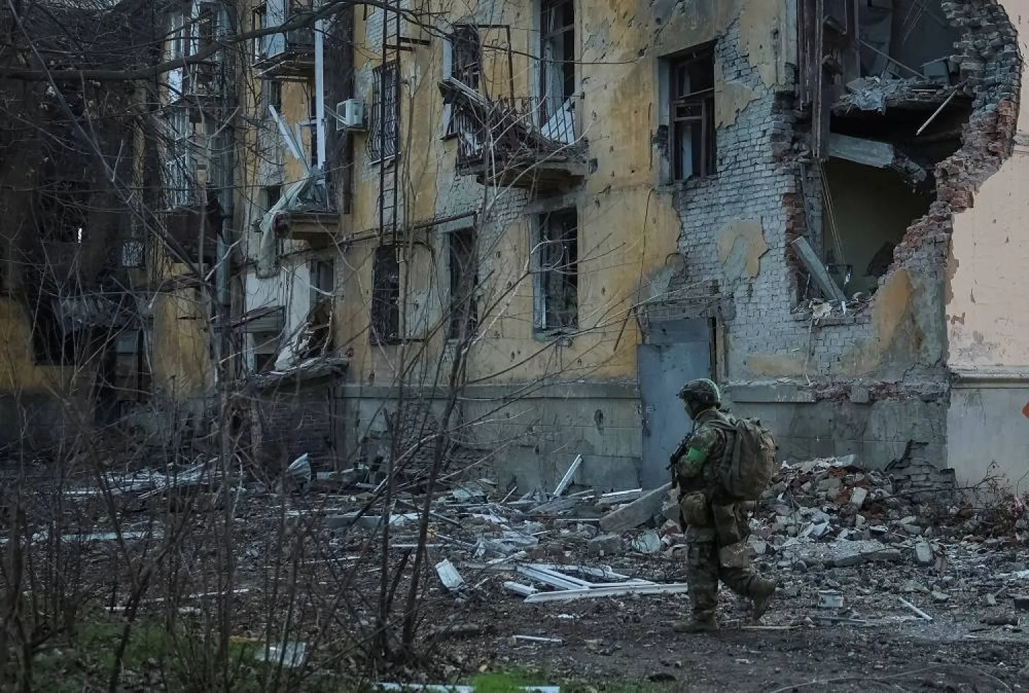 A serviceman of the 49th Separate Assault Battalion Carpathian Sich of the Armed Forces of Ukraine walks near an apartment building damaged by Russian military strike, amid Russia's attack on Ukraine, in the frontline town of Kostiantynivka in Donetsk region, Ukraine December 7, 2025. (Reuters)
